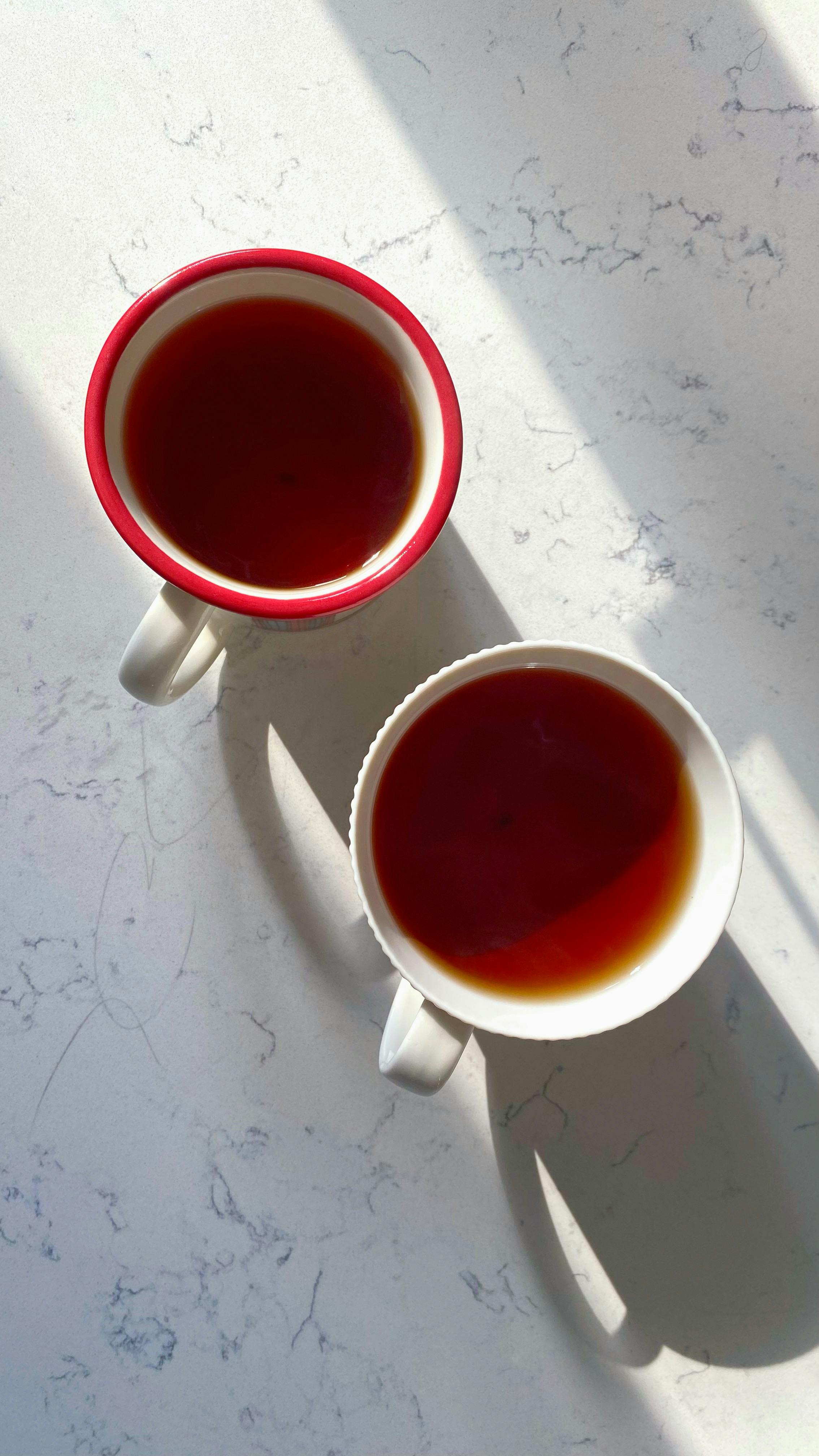 Two Cups of Tea on Marble Countertop