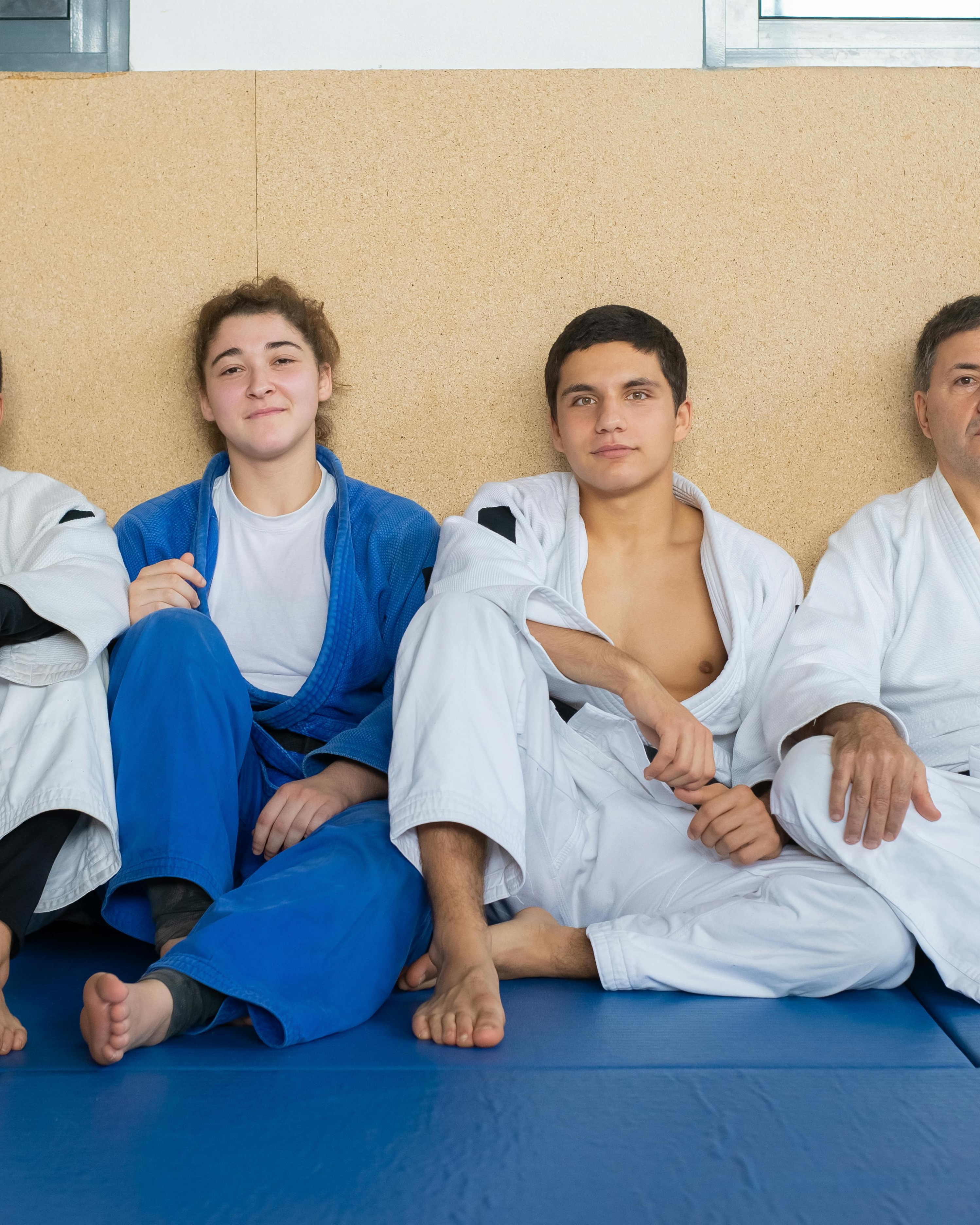 Martial Arts Students Resting in Dojo