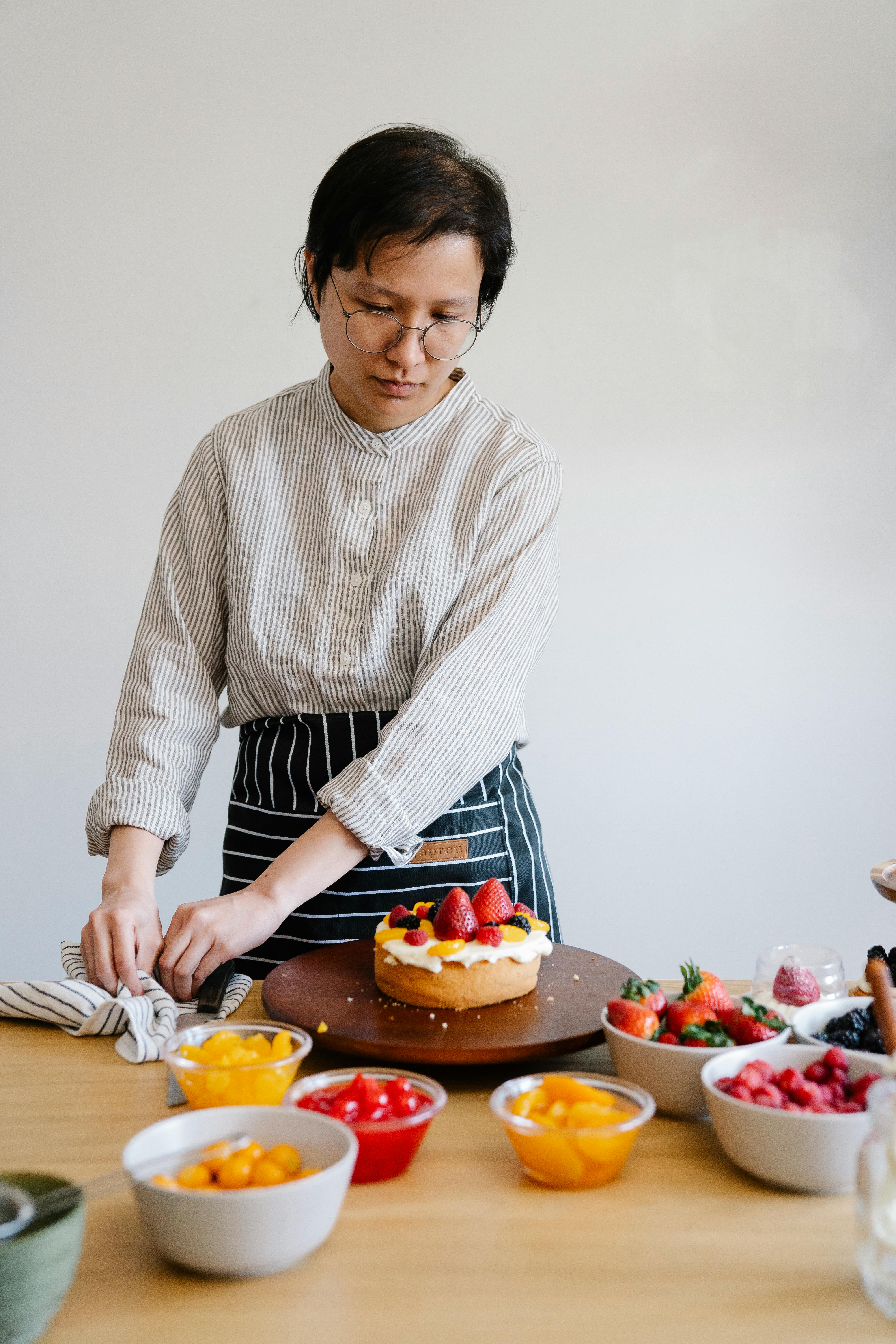 Baker Preparing Decorated Fruit Cake