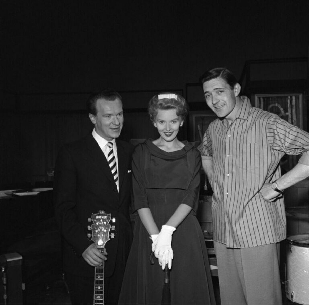 Three People Posing in Recording Studio