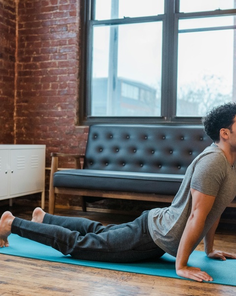 Man Practicing Yoga Cobra Pose