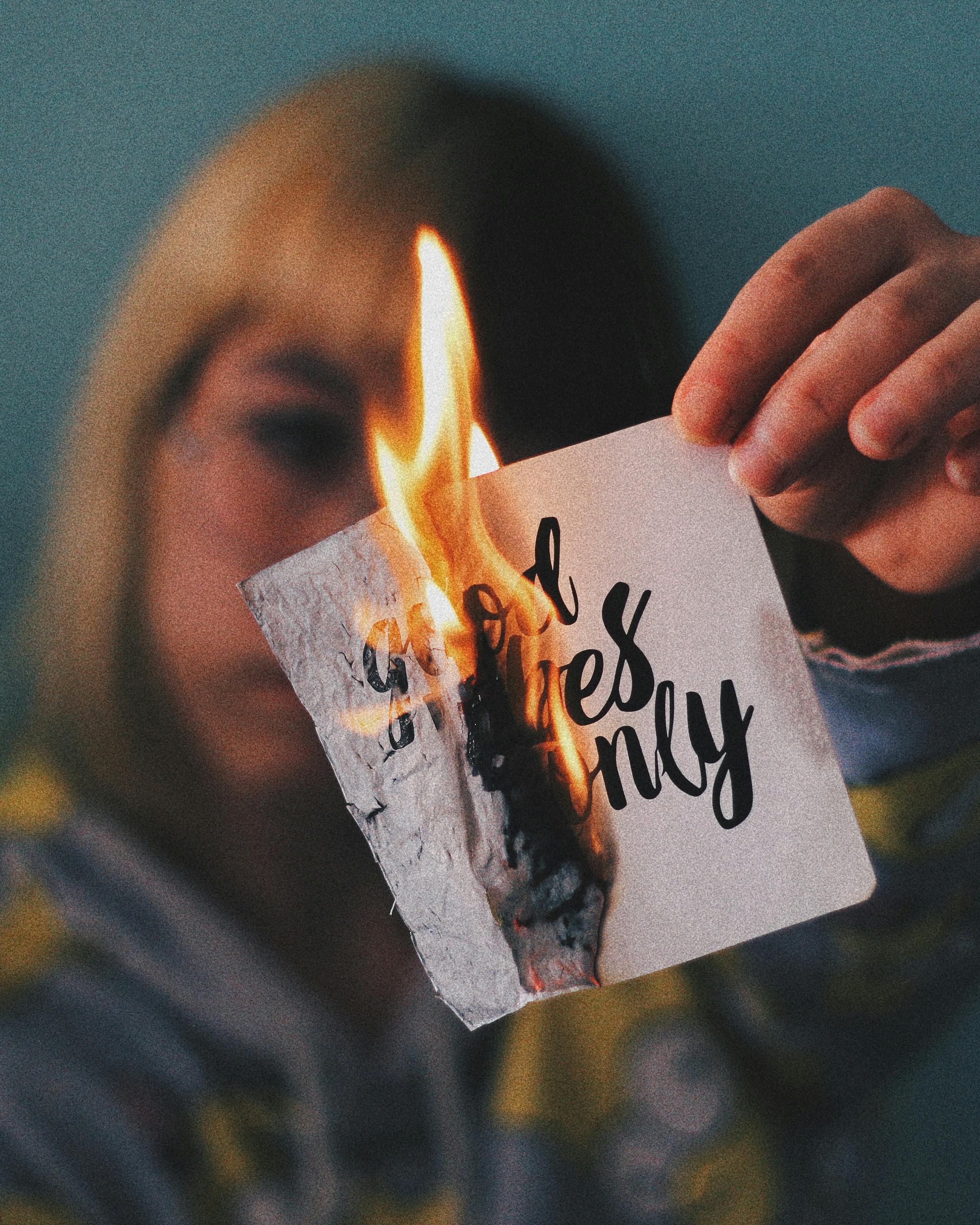 Woman Burning Good Vibes Only Paper