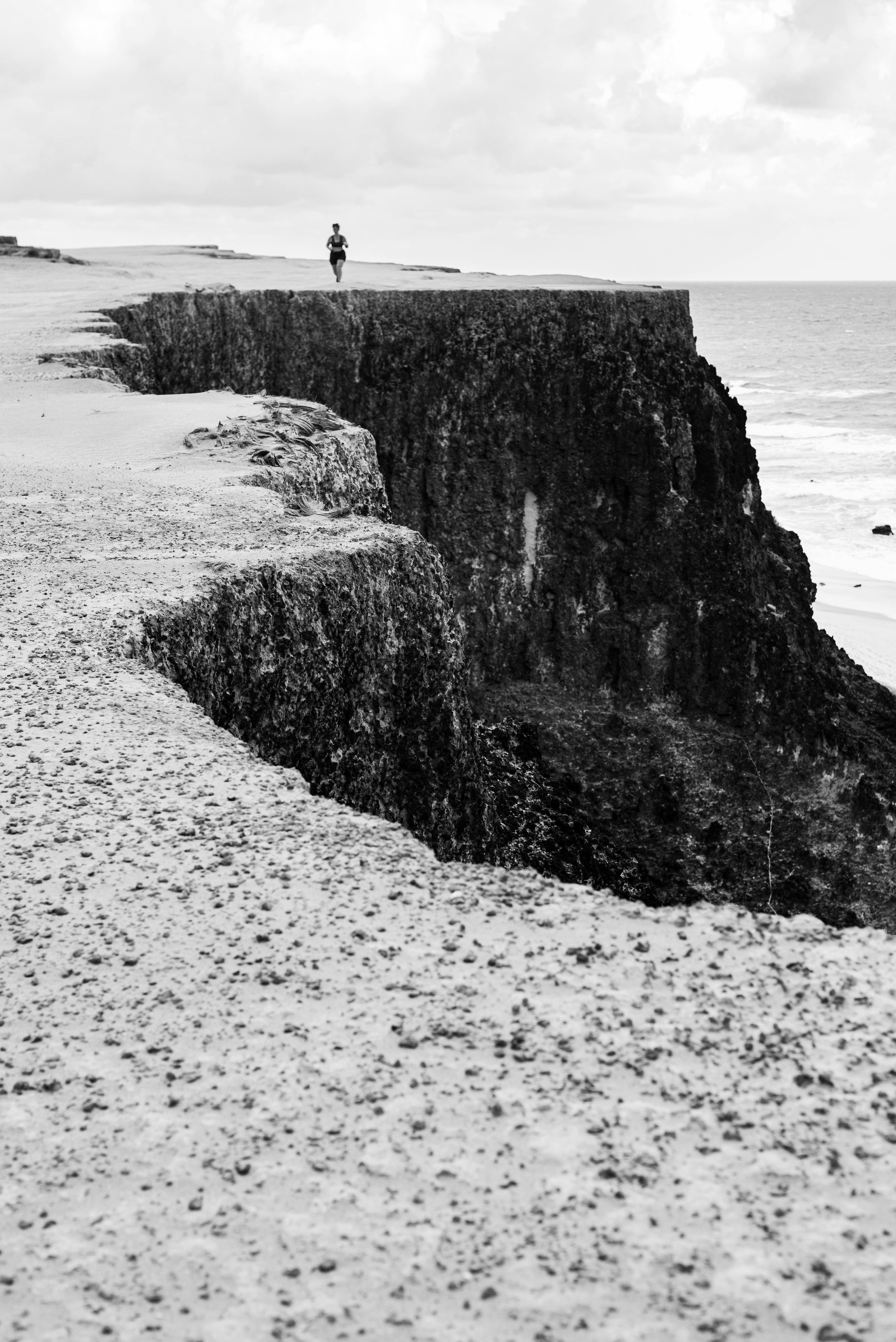 Runner on Coastal Cliff Top