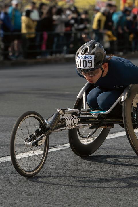 Wheelchair Racer Competing in Road Race
