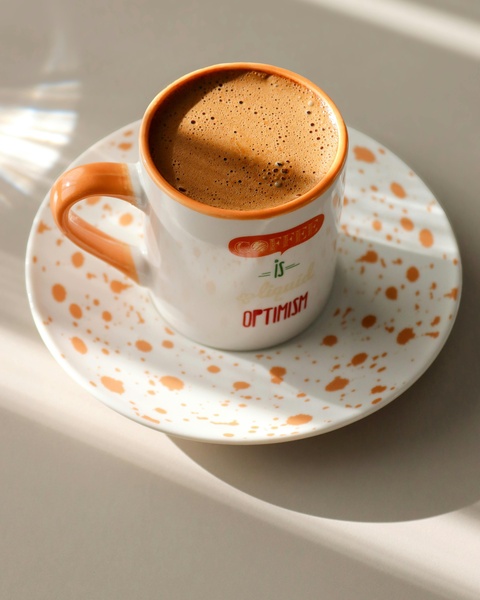Frothy Coffee in Decorative Mug