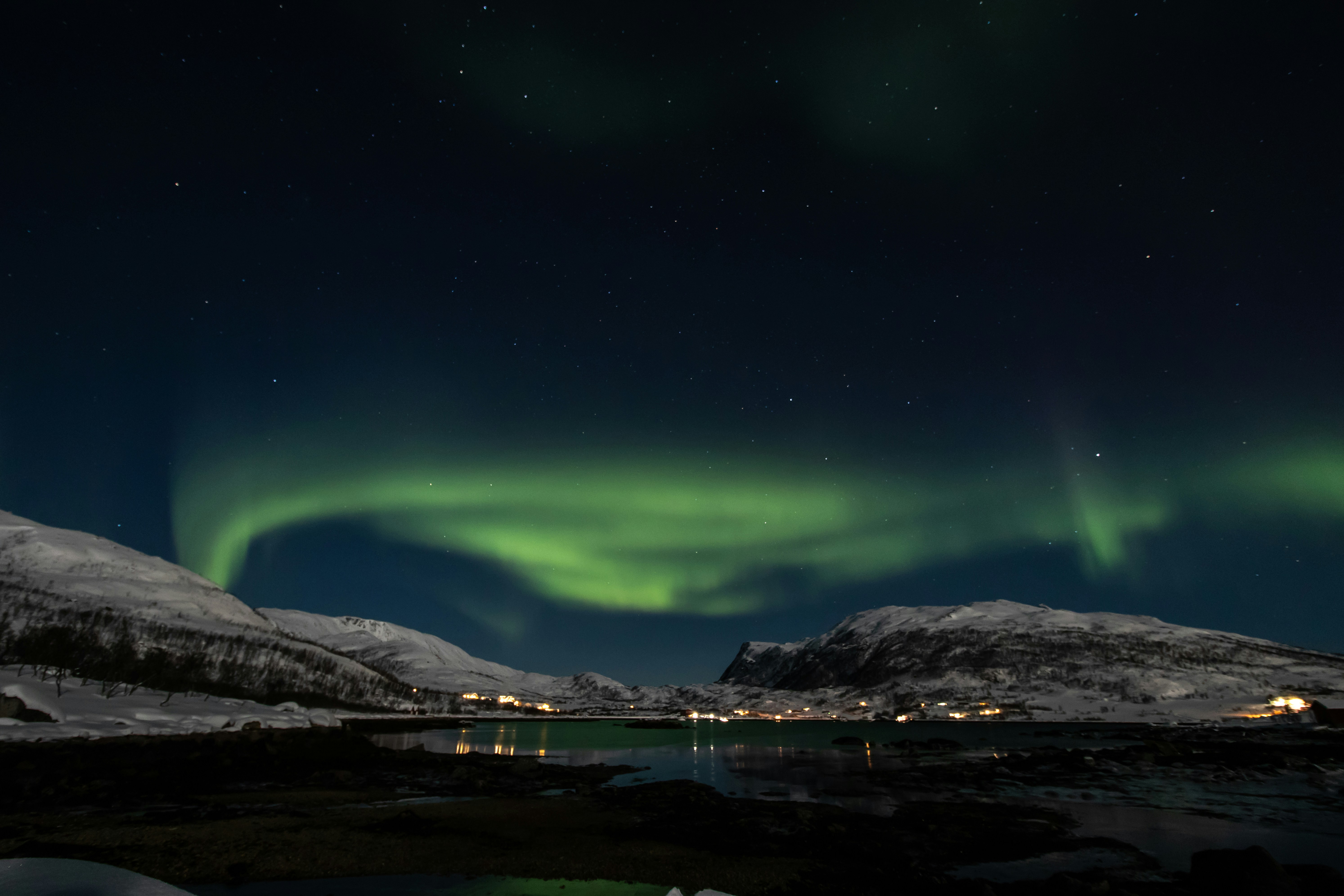 Aurora Borealis Over Snowy Fjord