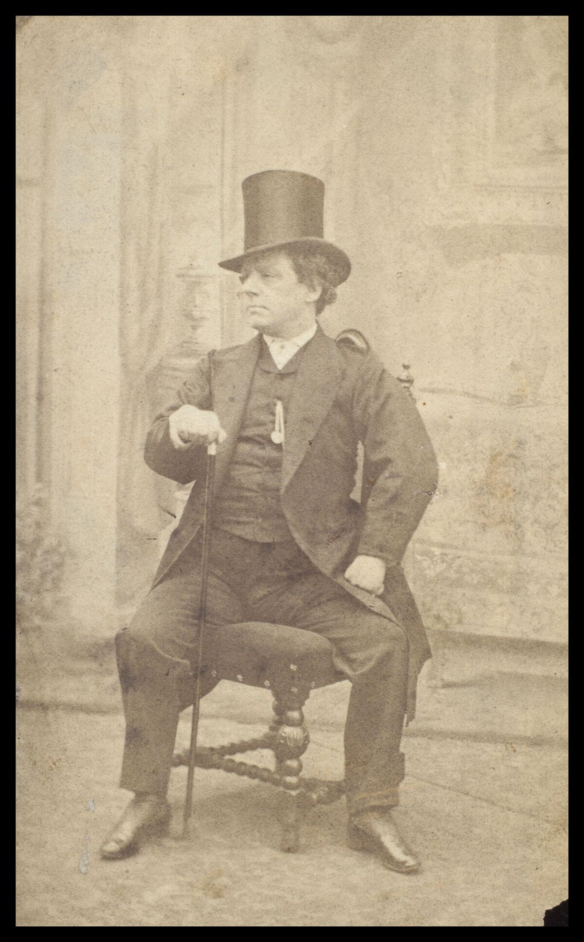 Vintage Portrait of Seated Man with Top Hat
