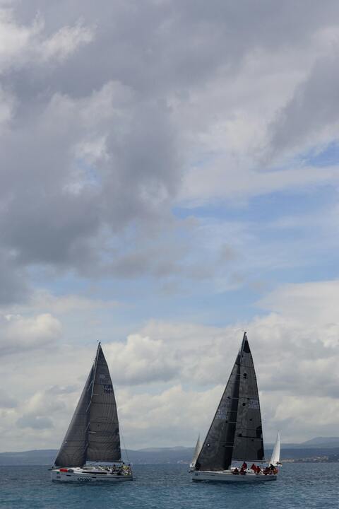 Two Racing Sailboats on Open Sea