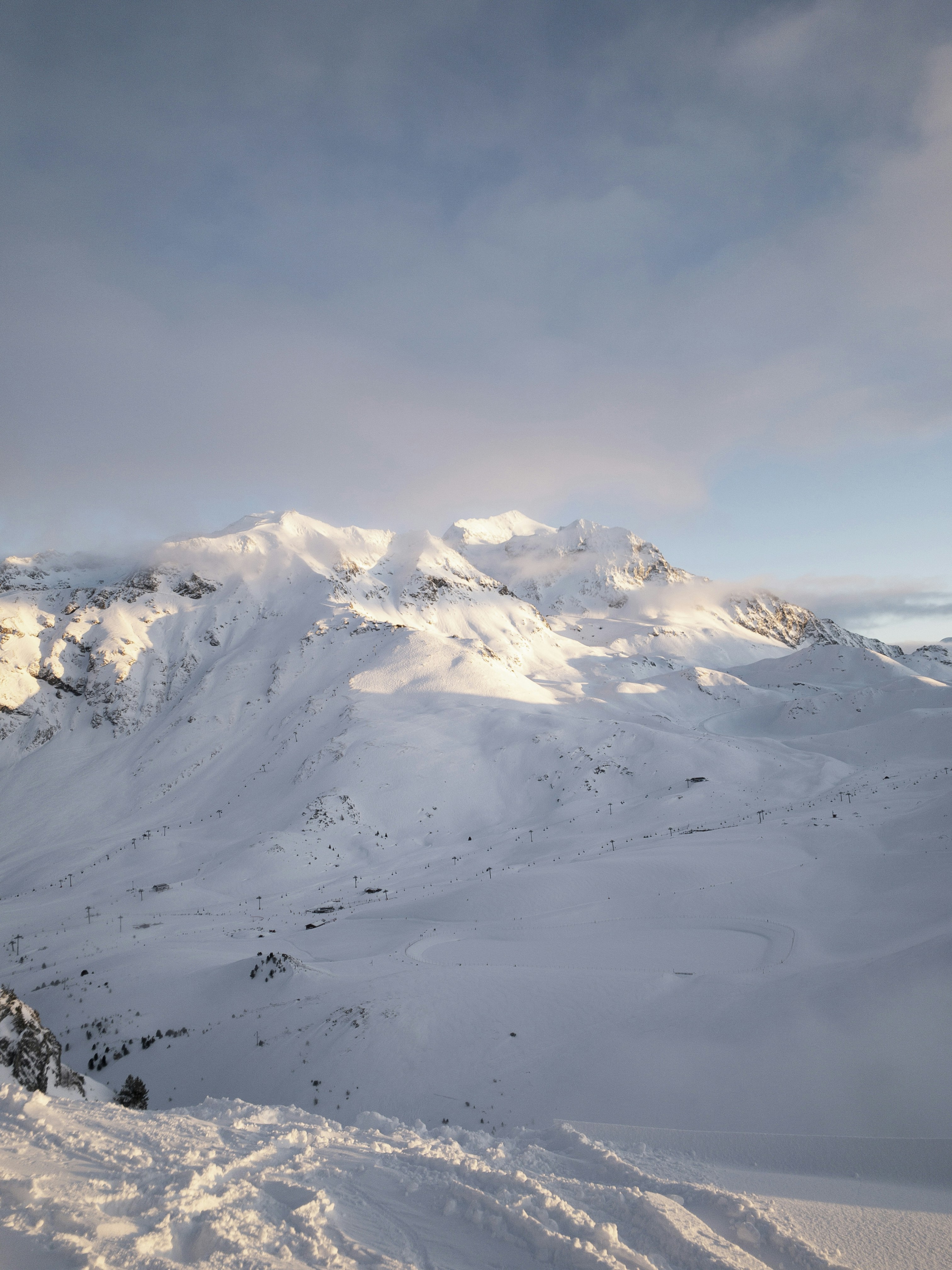 Sunlit Snowy Mountain Ski Resort