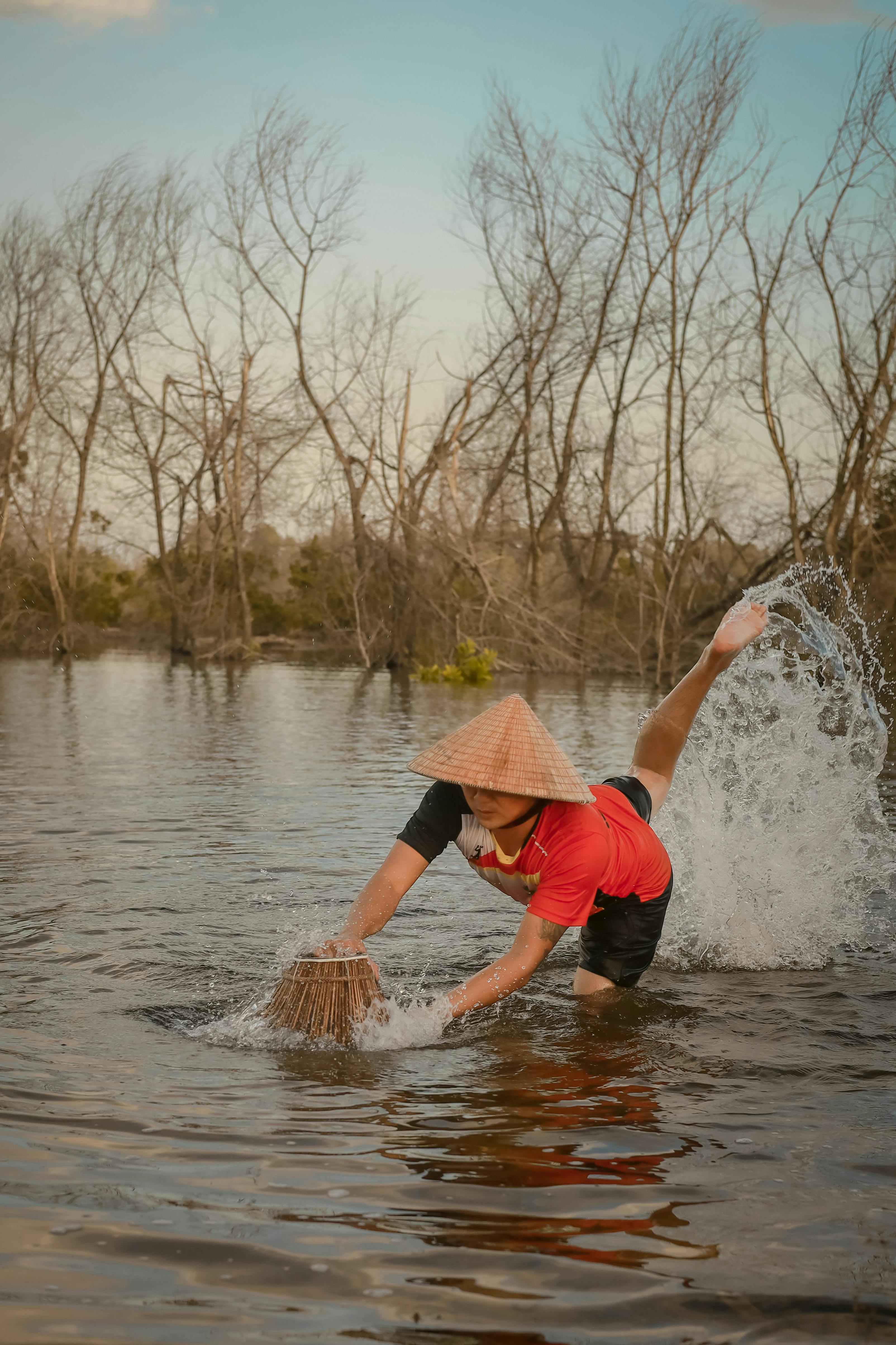 Fisherman Catching Fish With Traditional Trap