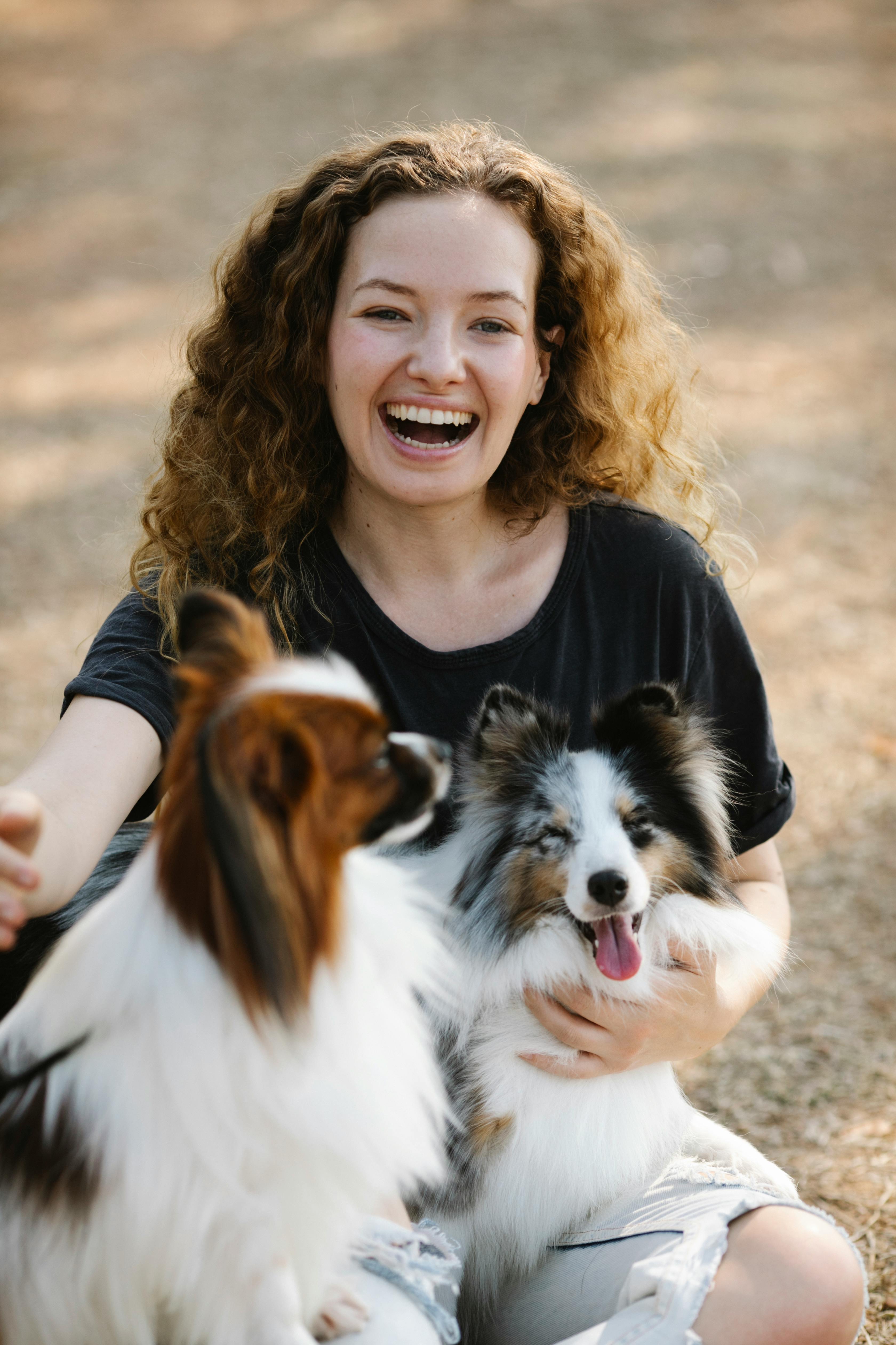 Smiling Woman With Two Pet Dogs