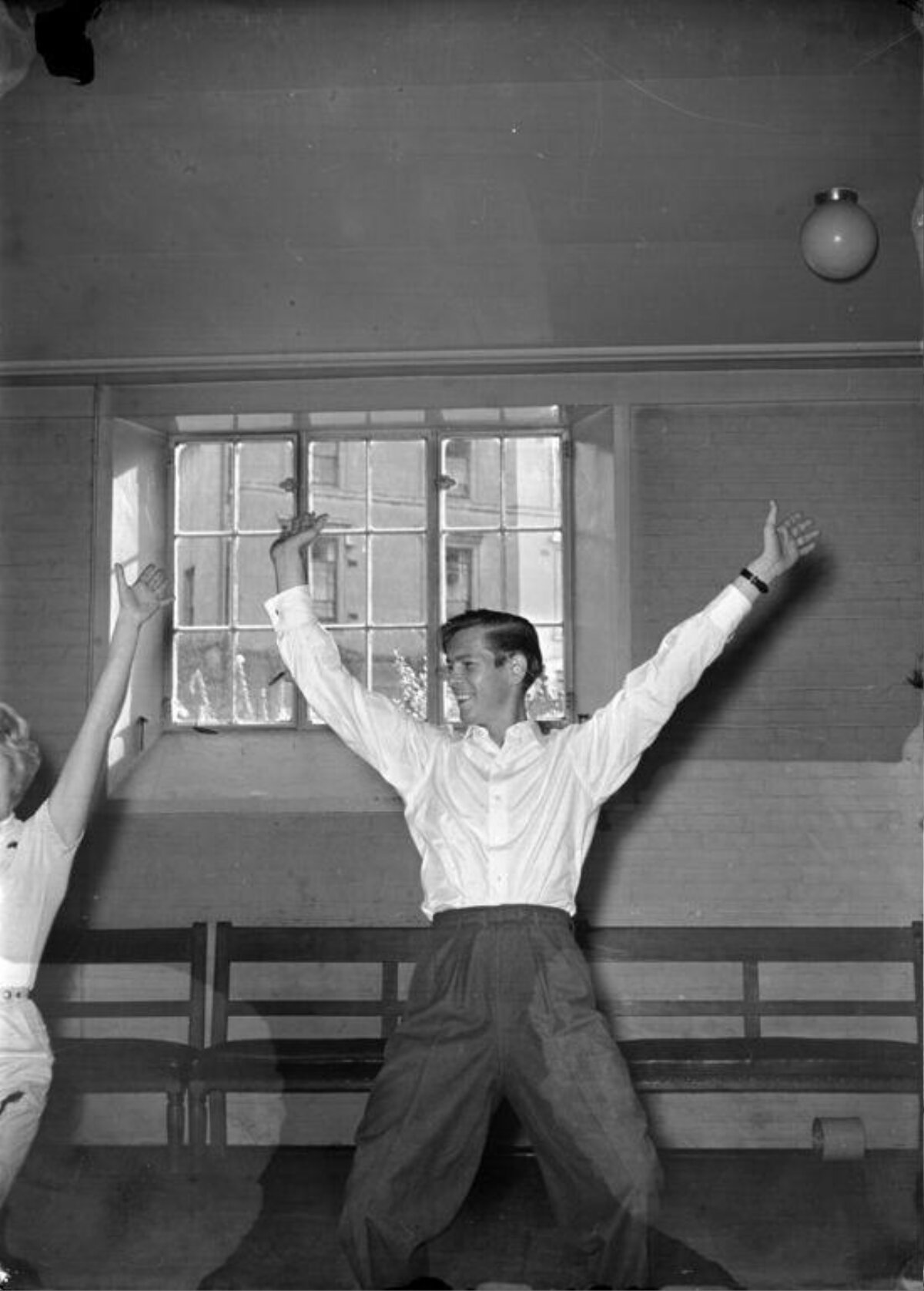 Young Man Doing Indoor Stretching