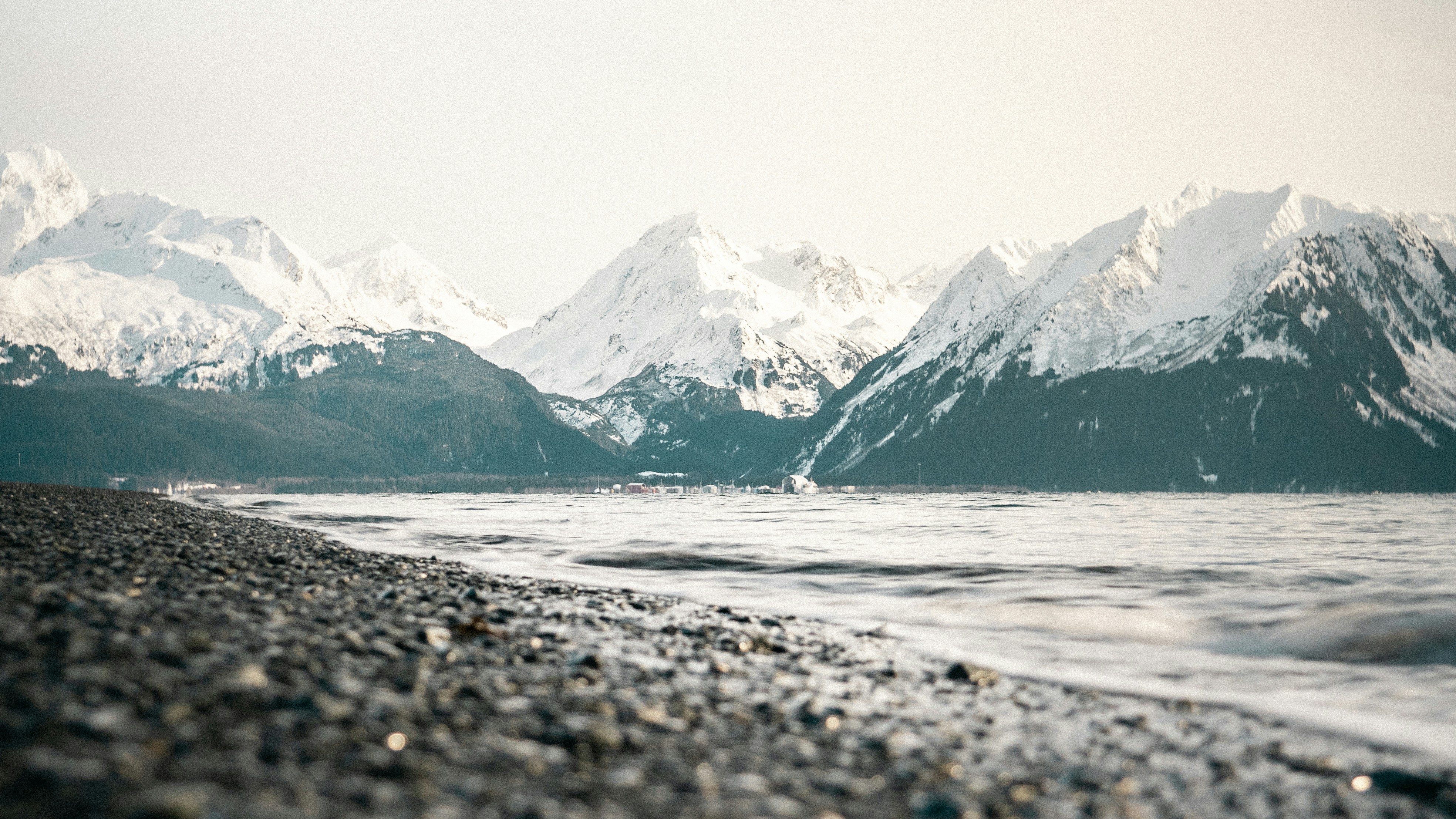 Snowy Mountains By Gravel Shoreline