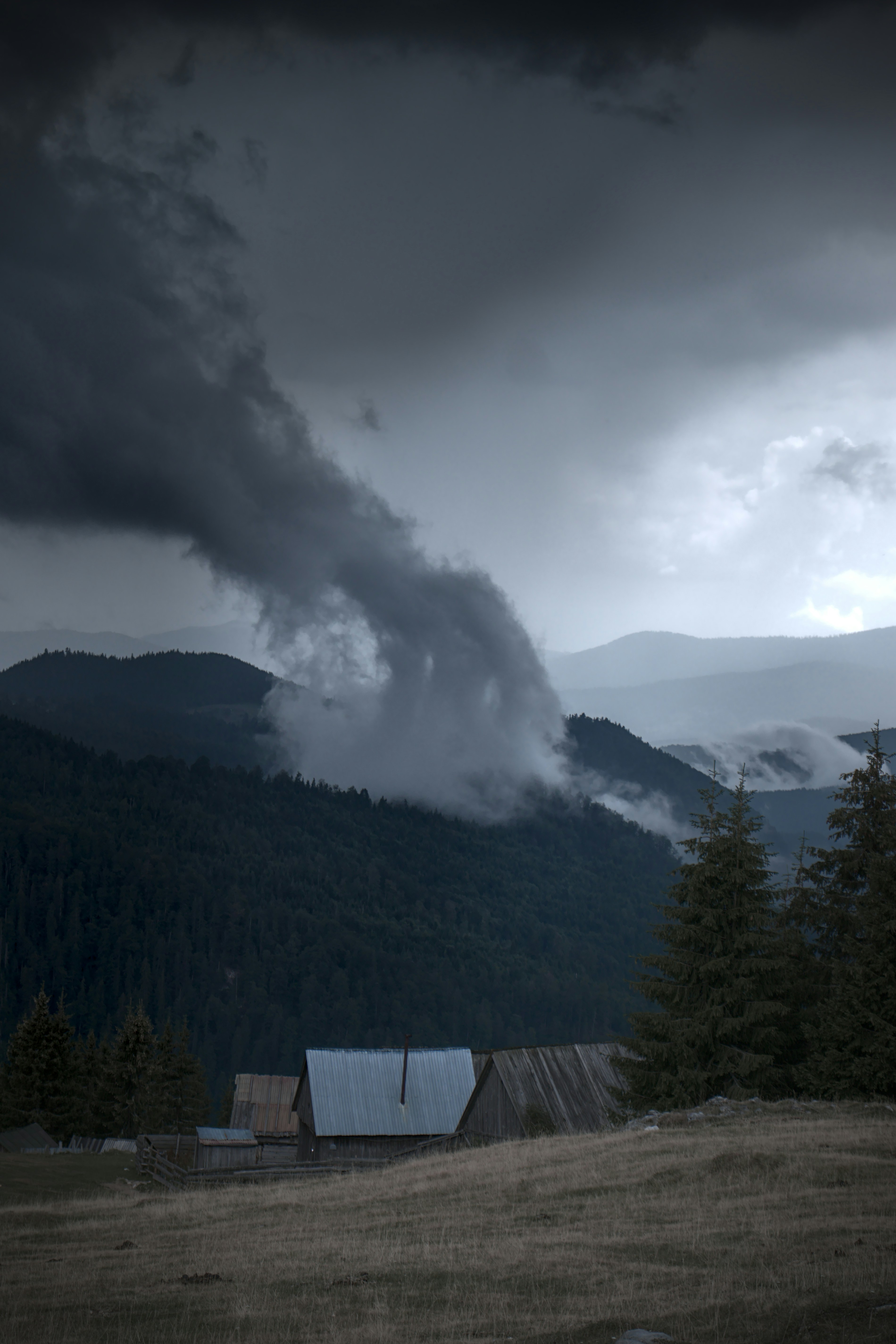 Stormy Cloud Over Mountain Cabins