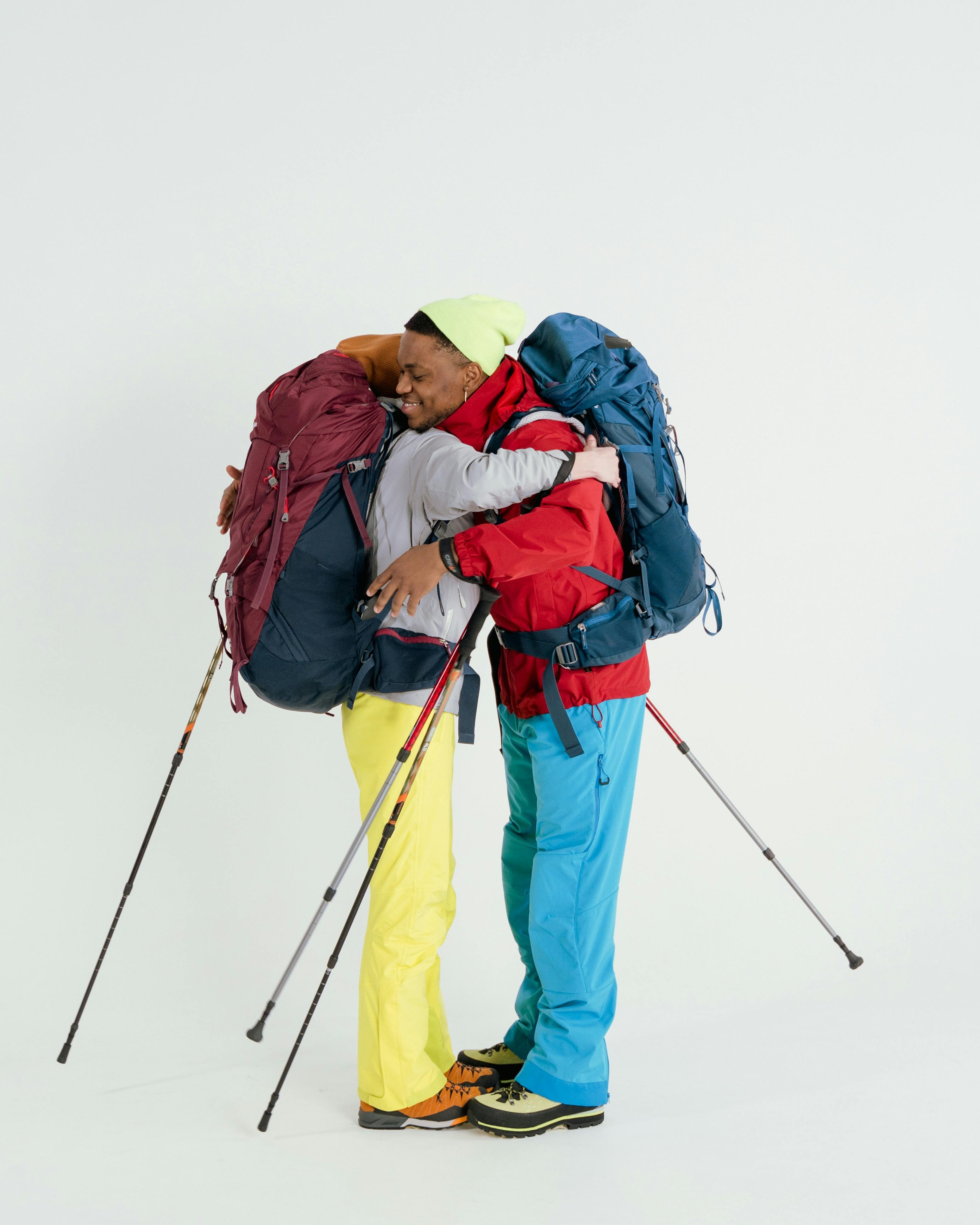 Two Fully Equipped Hikers Hugging