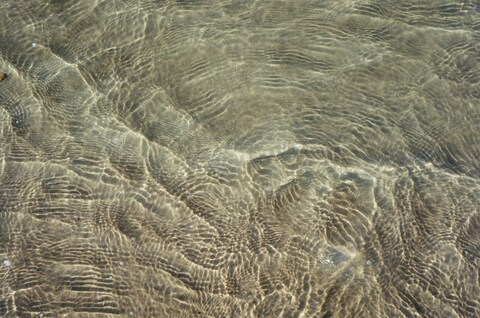 Clear Shallow Water Over Sand