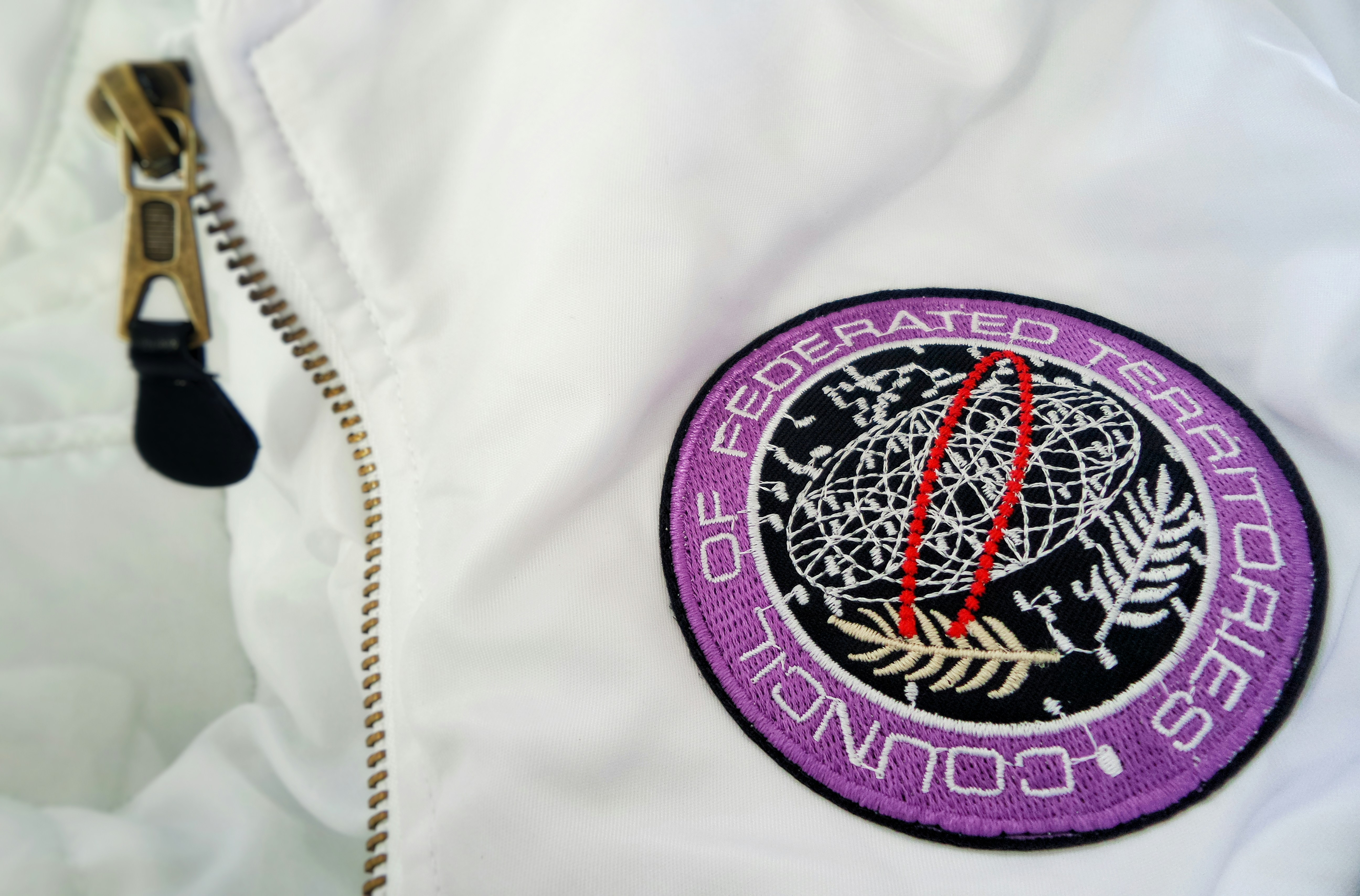 Embroidered Patch on White Jacket