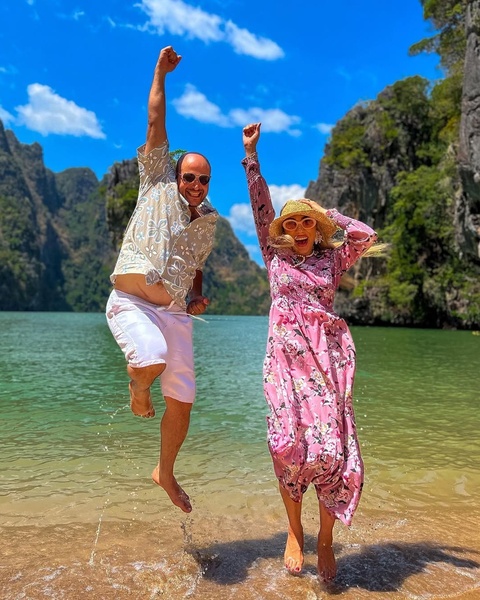 Happy Couple Jumping in Tropical Lagoon