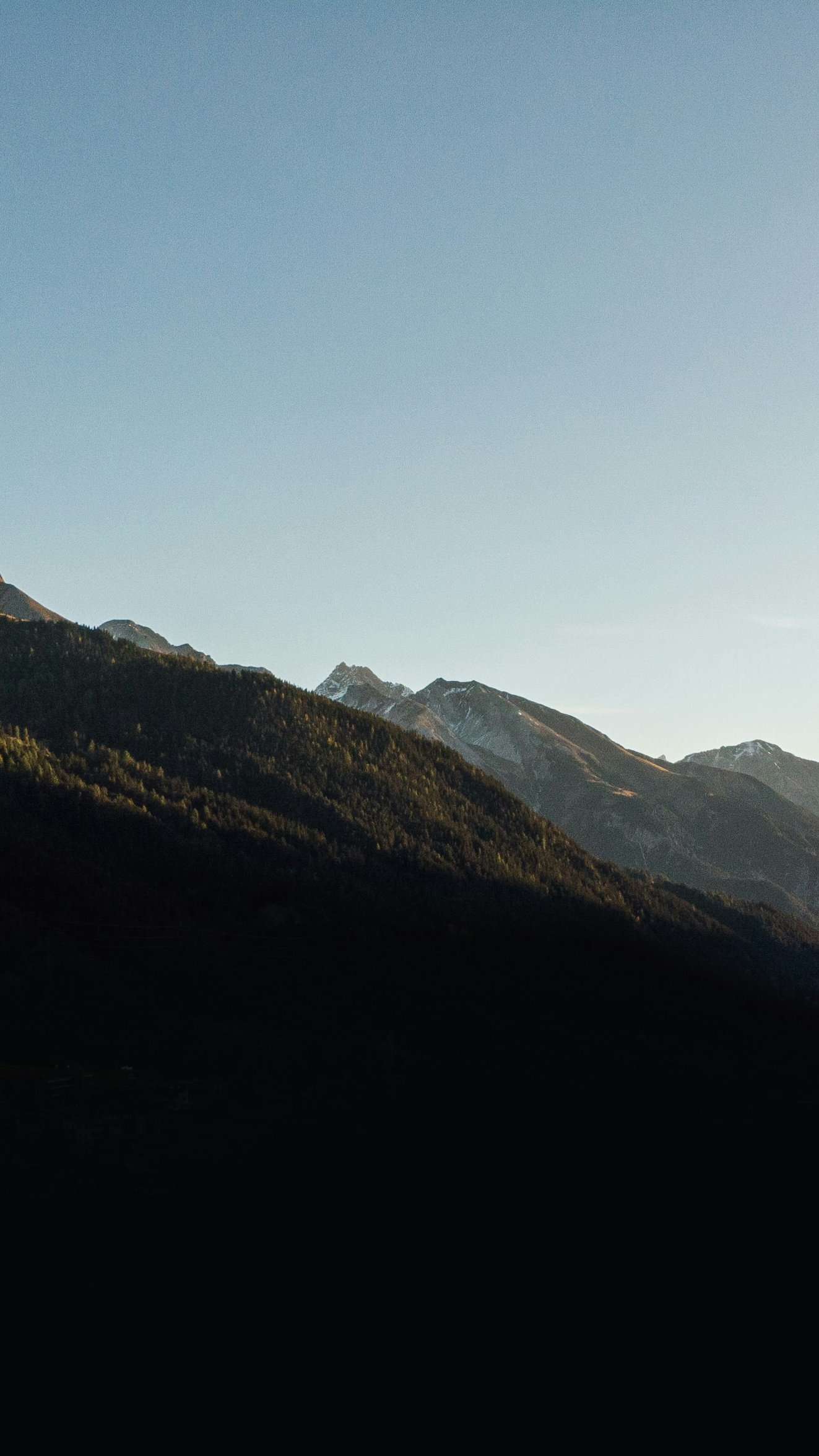 Mountain Peaks Under Clear Sky