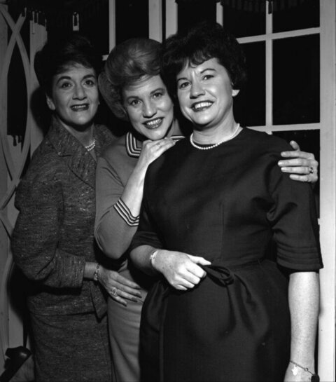 Three Smiling Women Posing Together