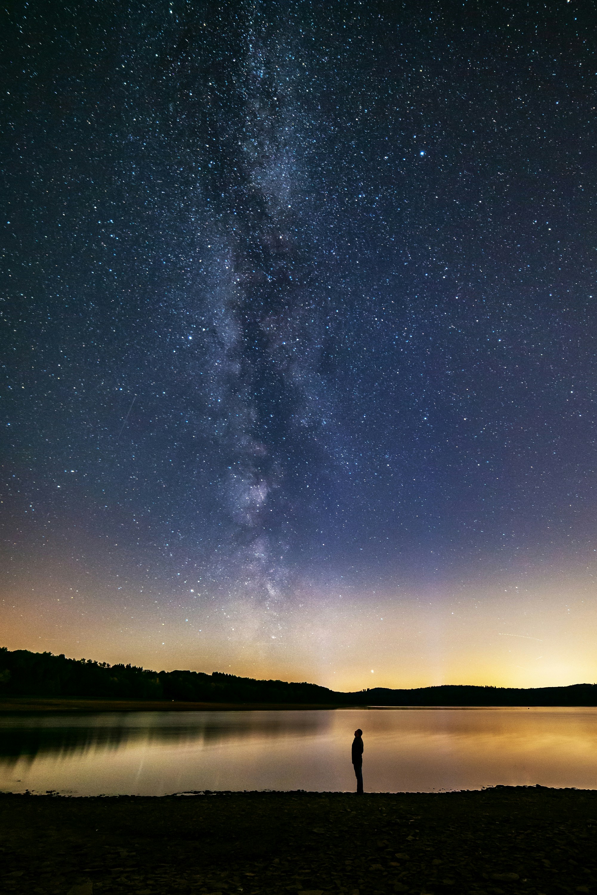 Lone Person Watching Milky Way Over Lake