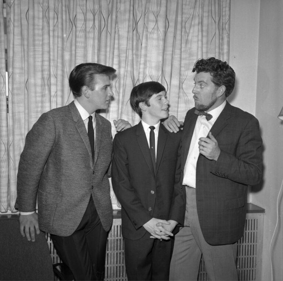 Three Men in Suits Chatting