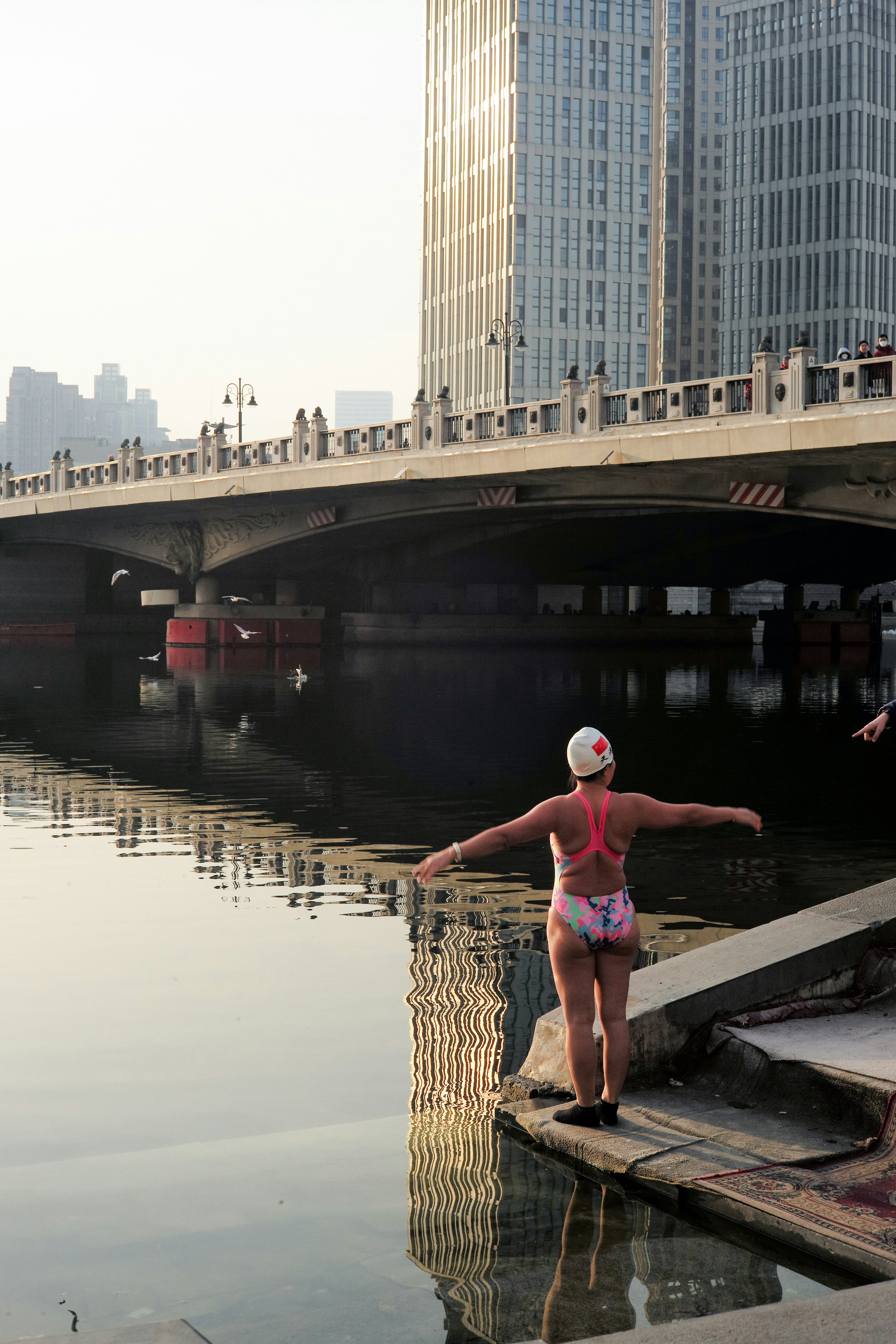 Winter Swimmer Preparing for River Swim
