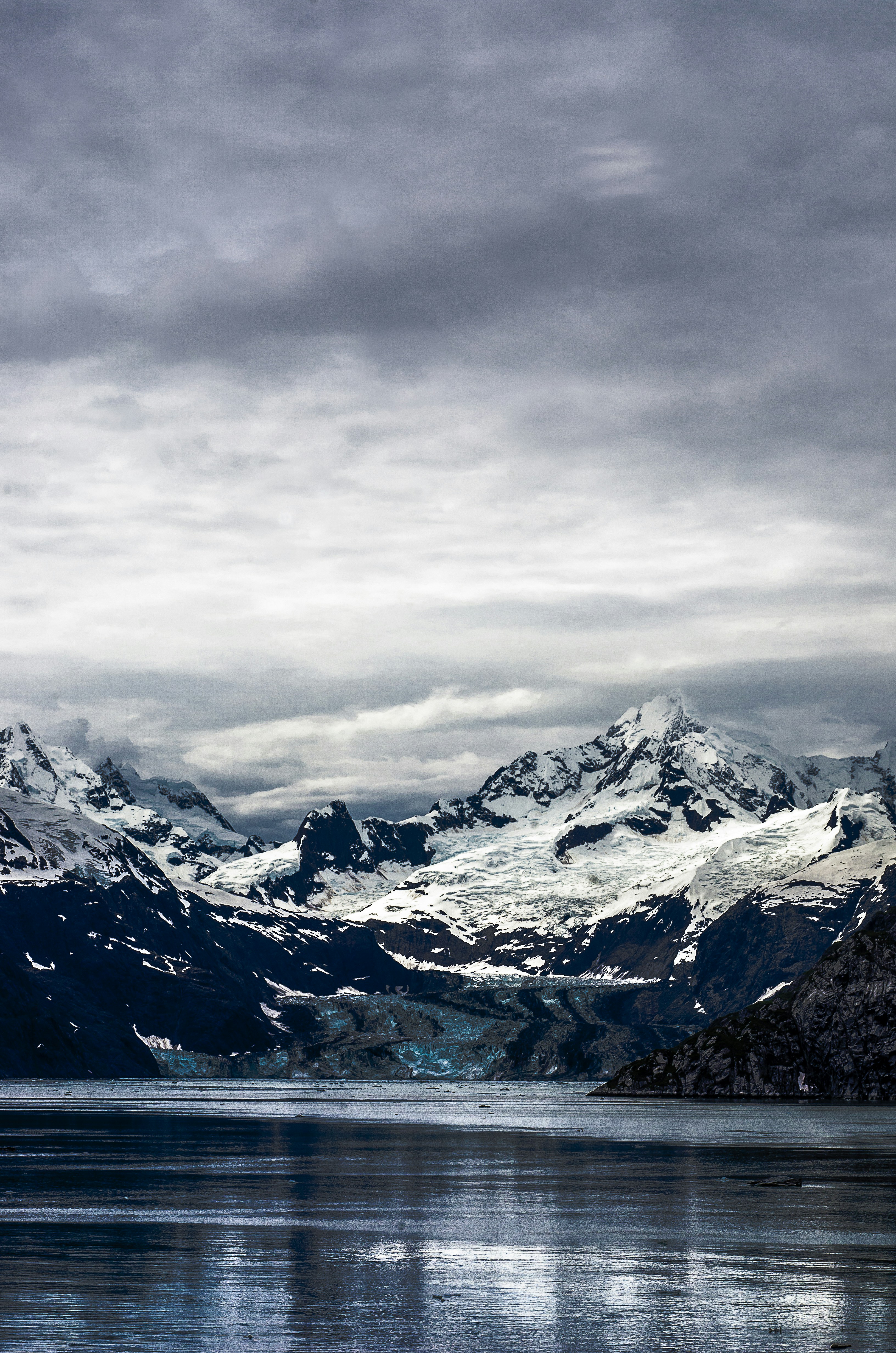 Snow-capped Mountains by Glacial Lake