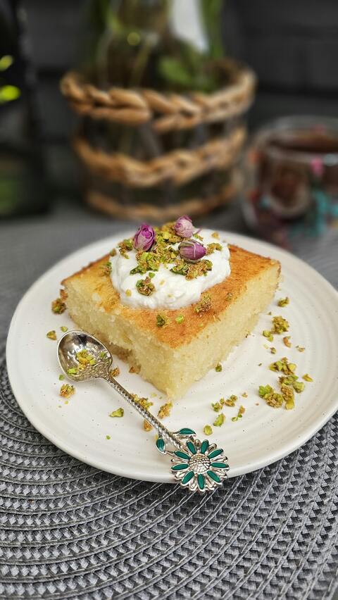 Pistachio Cream Garnished Cake Slice
