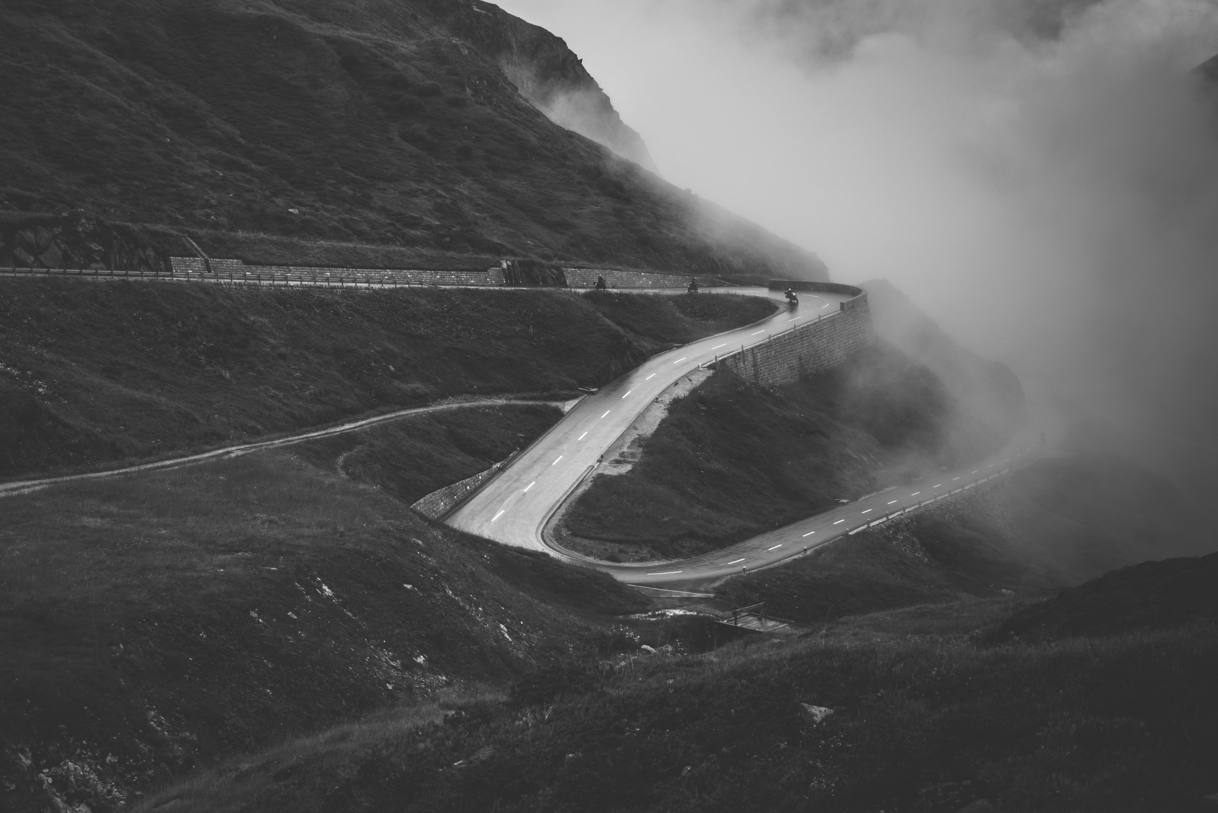 Foggy Winding Mountain Road With Motorcyclists