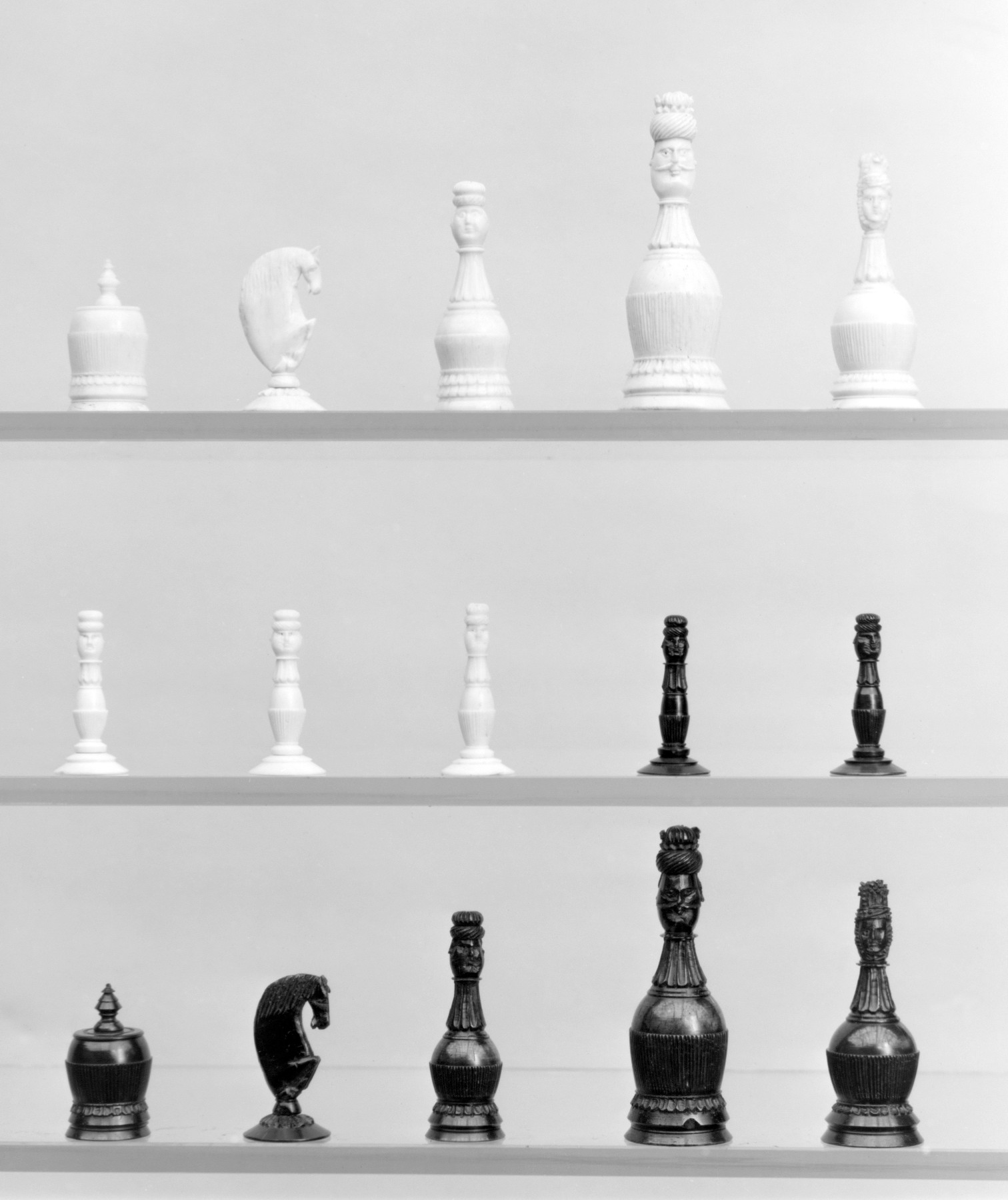Vintage Chess Pieces on Display Shelves