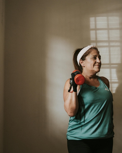 Middle-aged Woman Working Out With Dumbbell