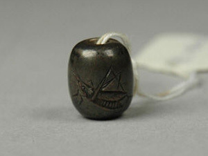 Carved Dark Bead Pendant