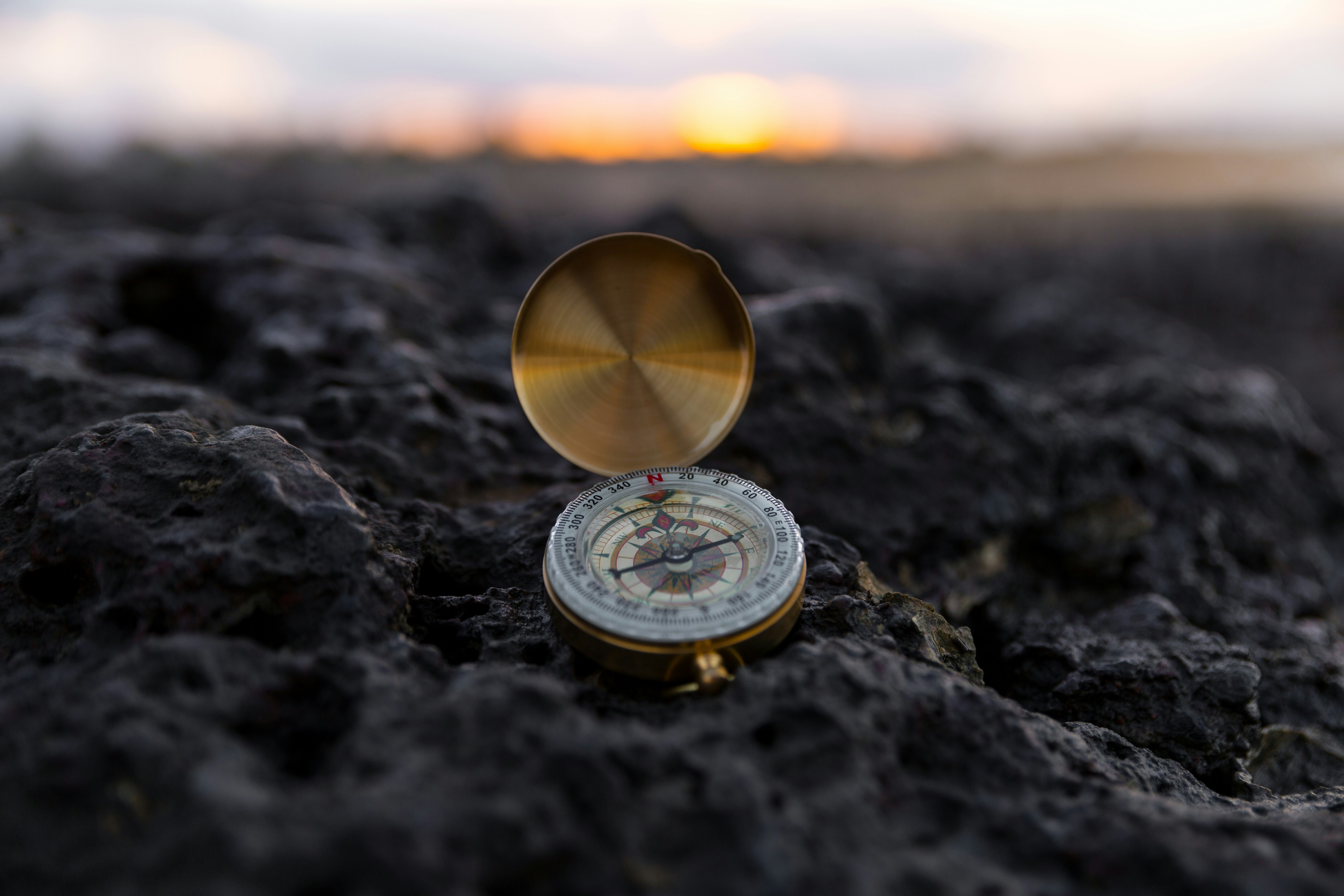 Compass on Rock at Sunset