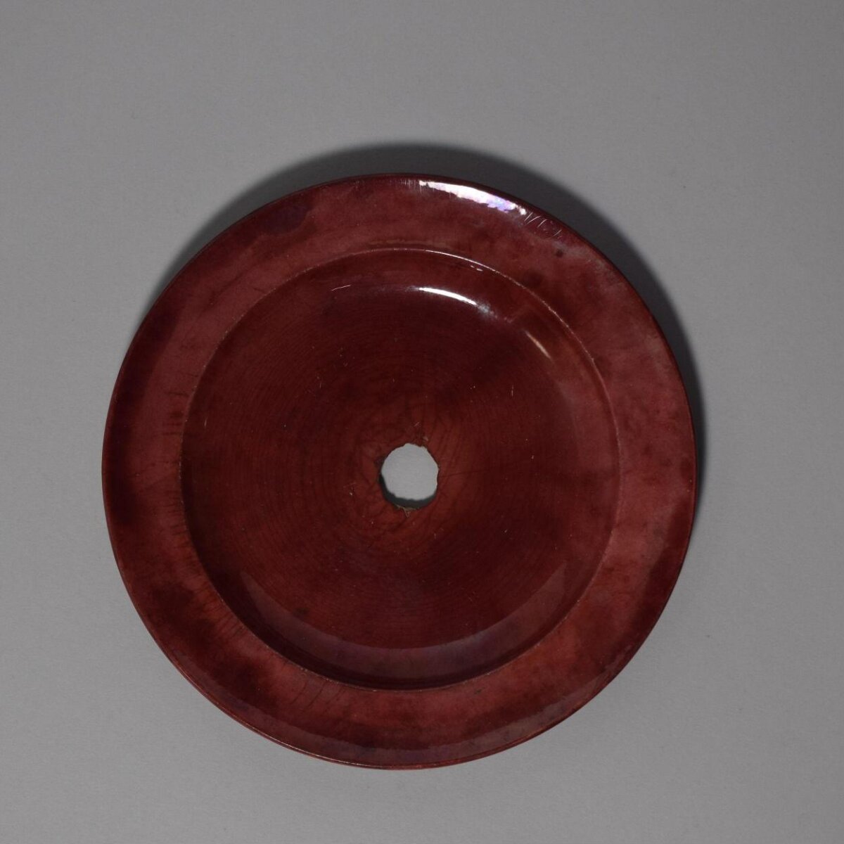 Red Glazed Ceramic Disc with Central Hole