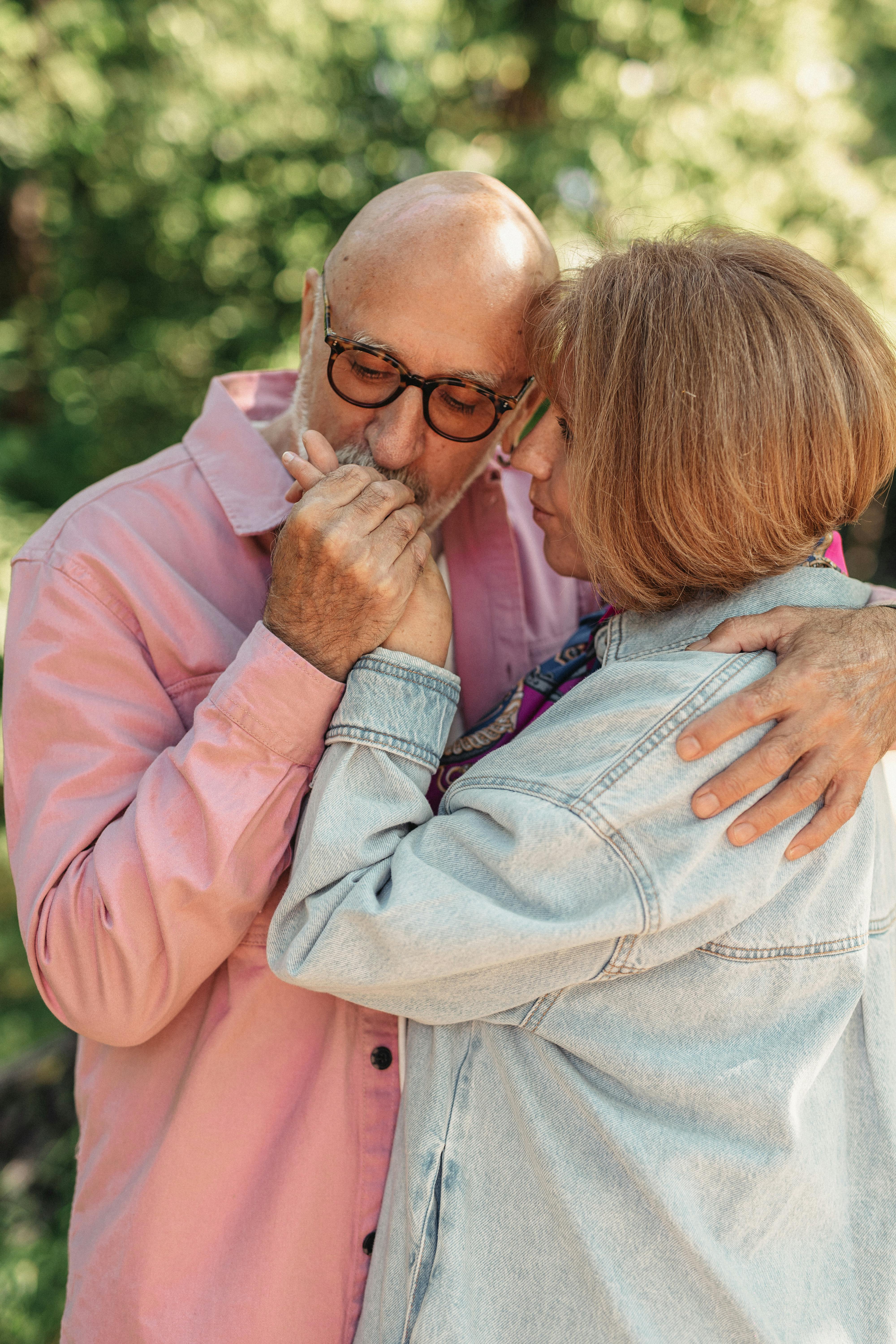 Affectionate Senior Couple Embracing Outdoors