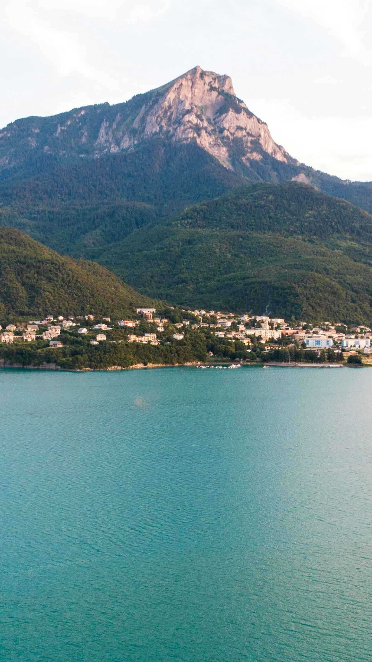 Lakeside Town with Mountain Backdrop