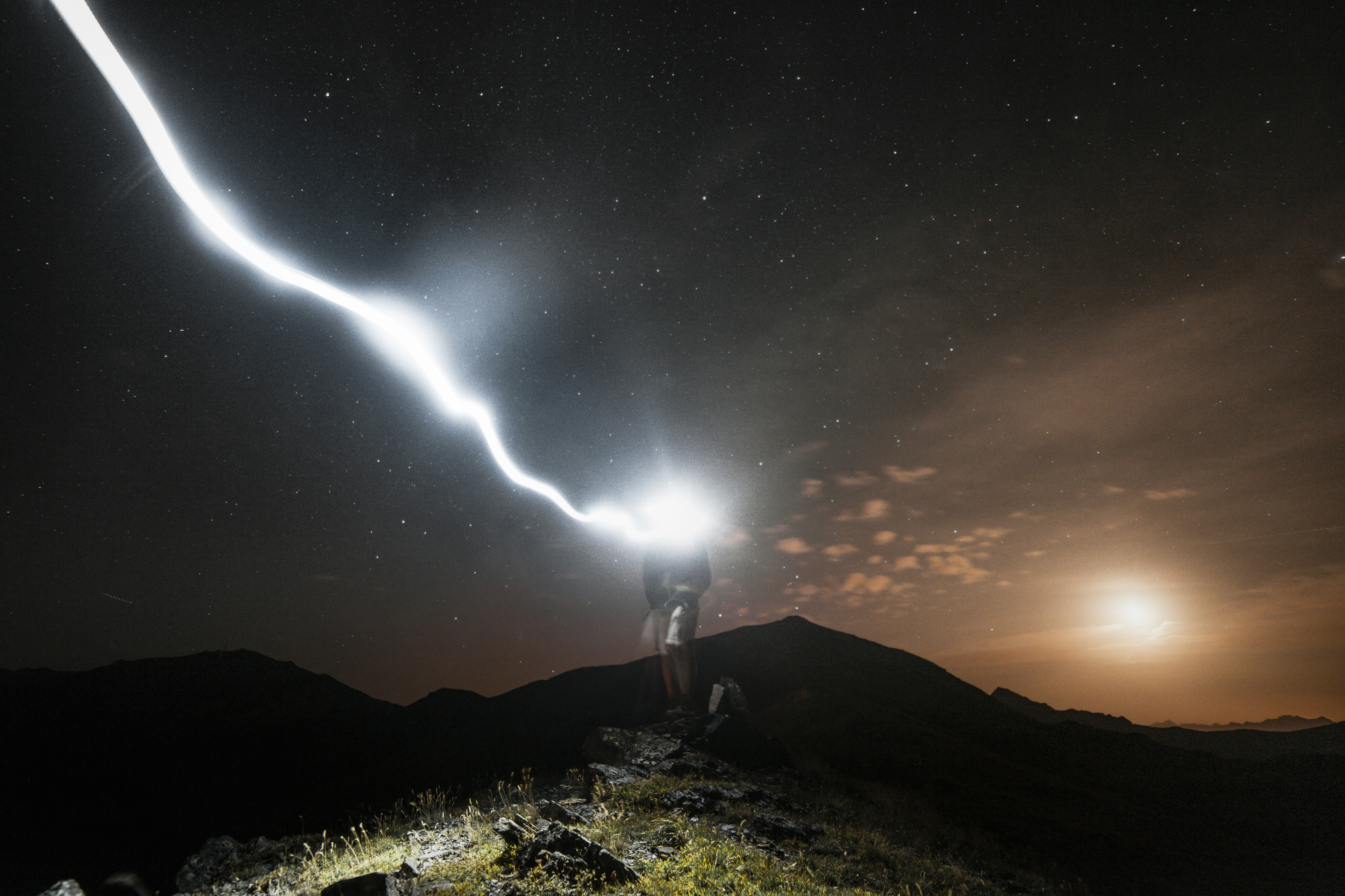 Night Hiker Light Trail on Mountain