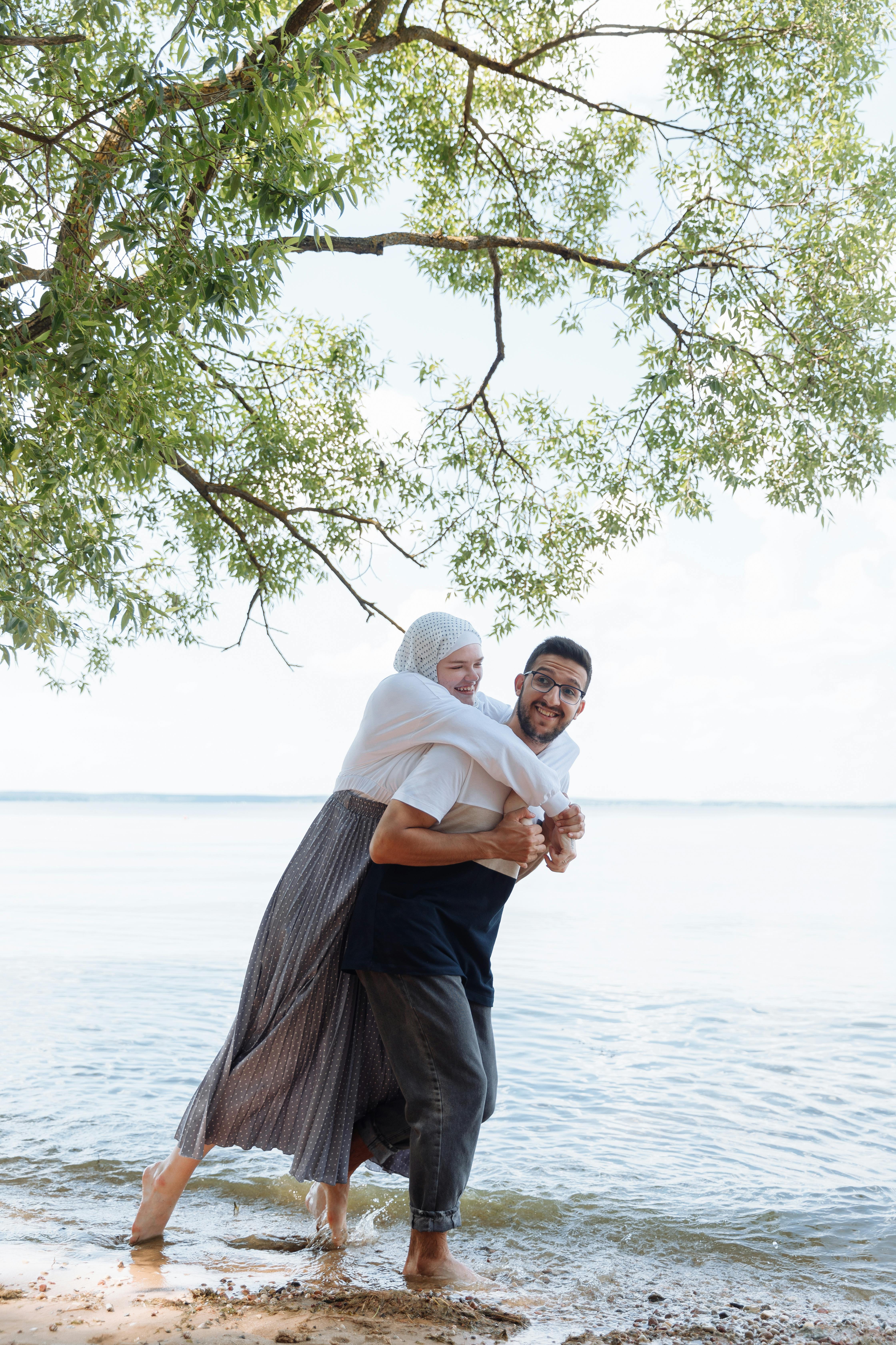 Happy Couple Piggyback at Lakeshore