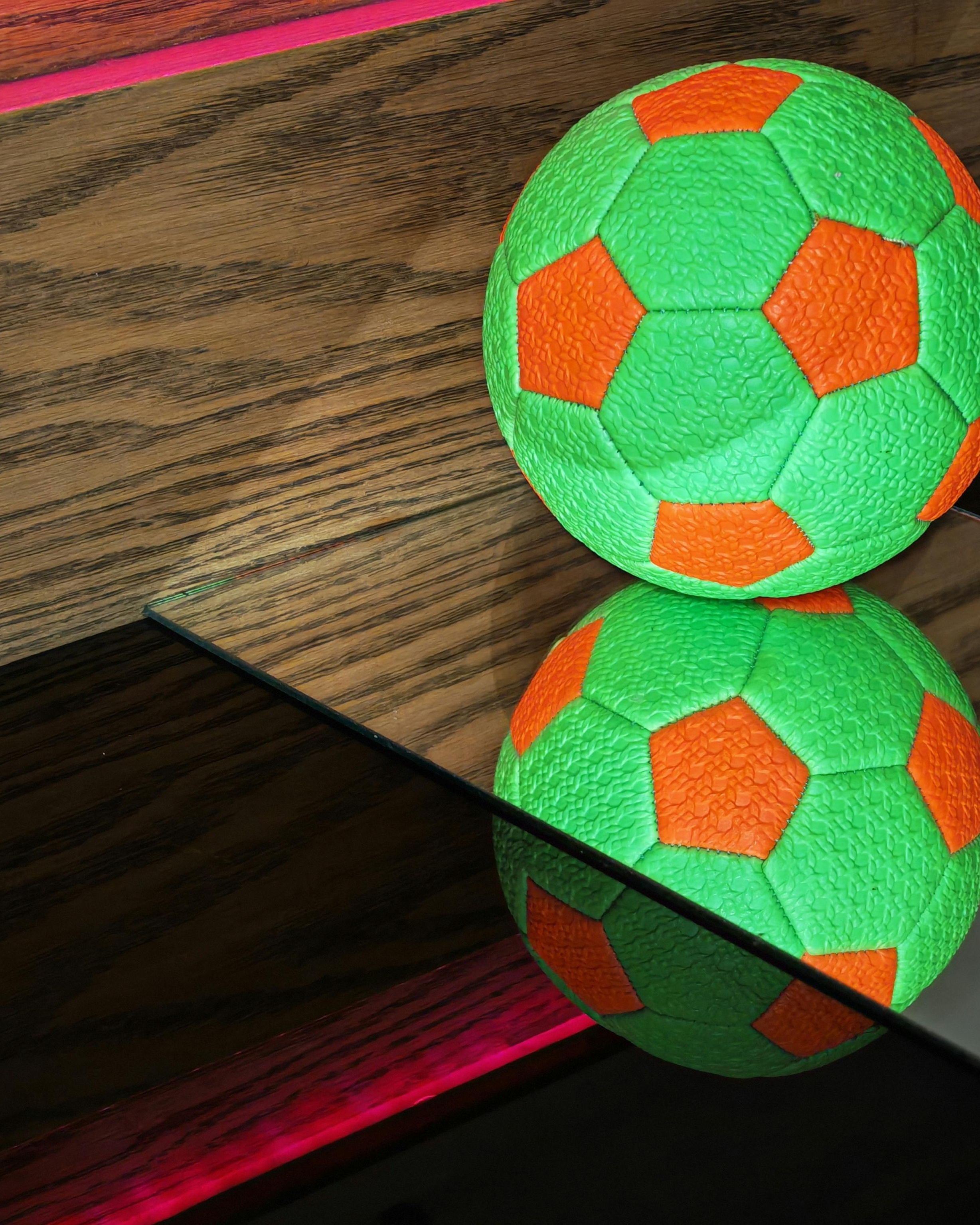 Green and Orange Soccer Ball With Reflection