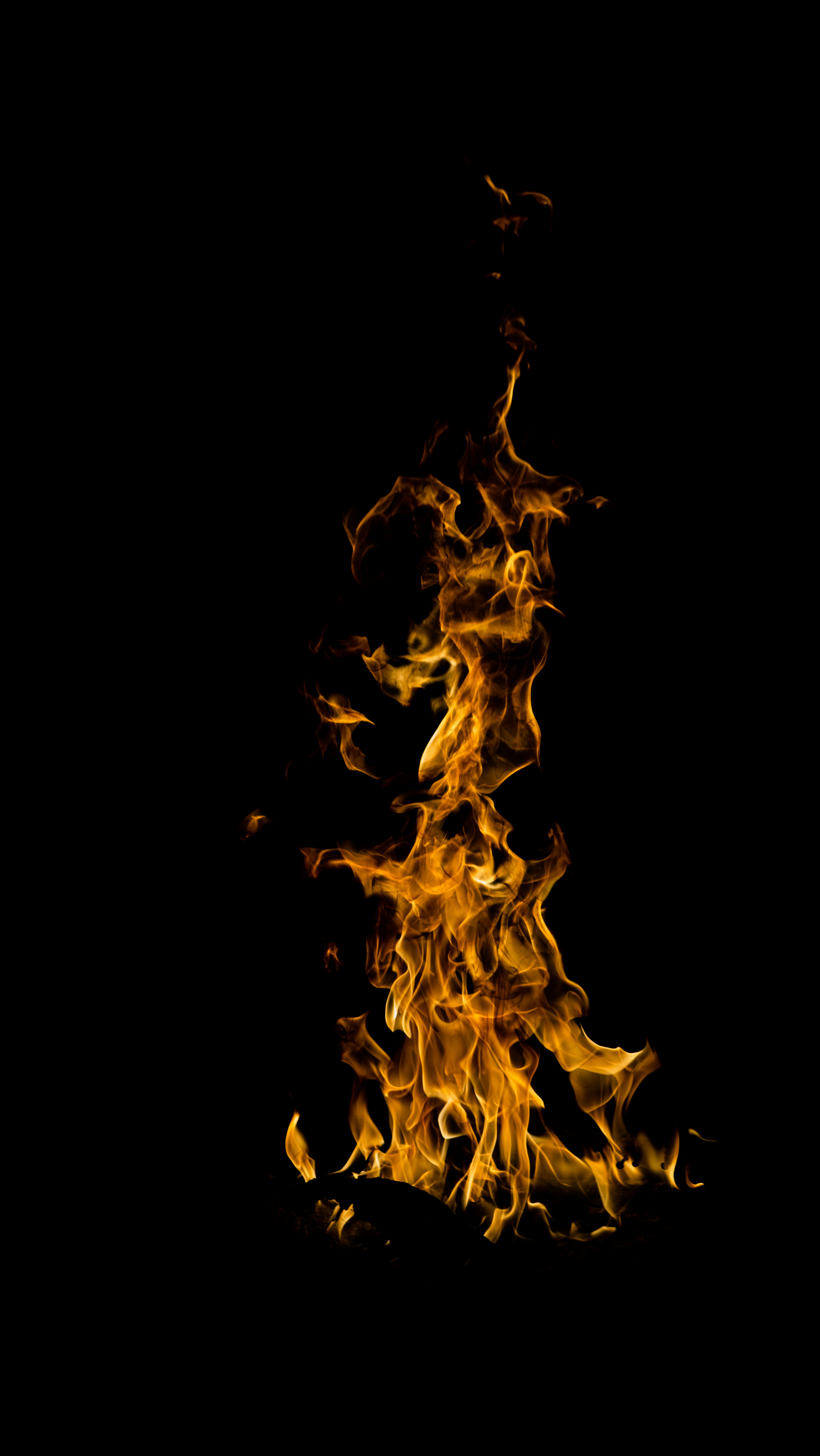 Burning Flame Against Black Background
