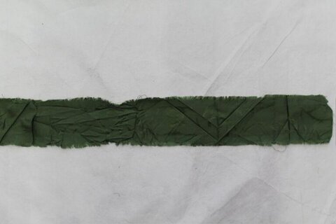 Folded Dark Green Fabric Strip