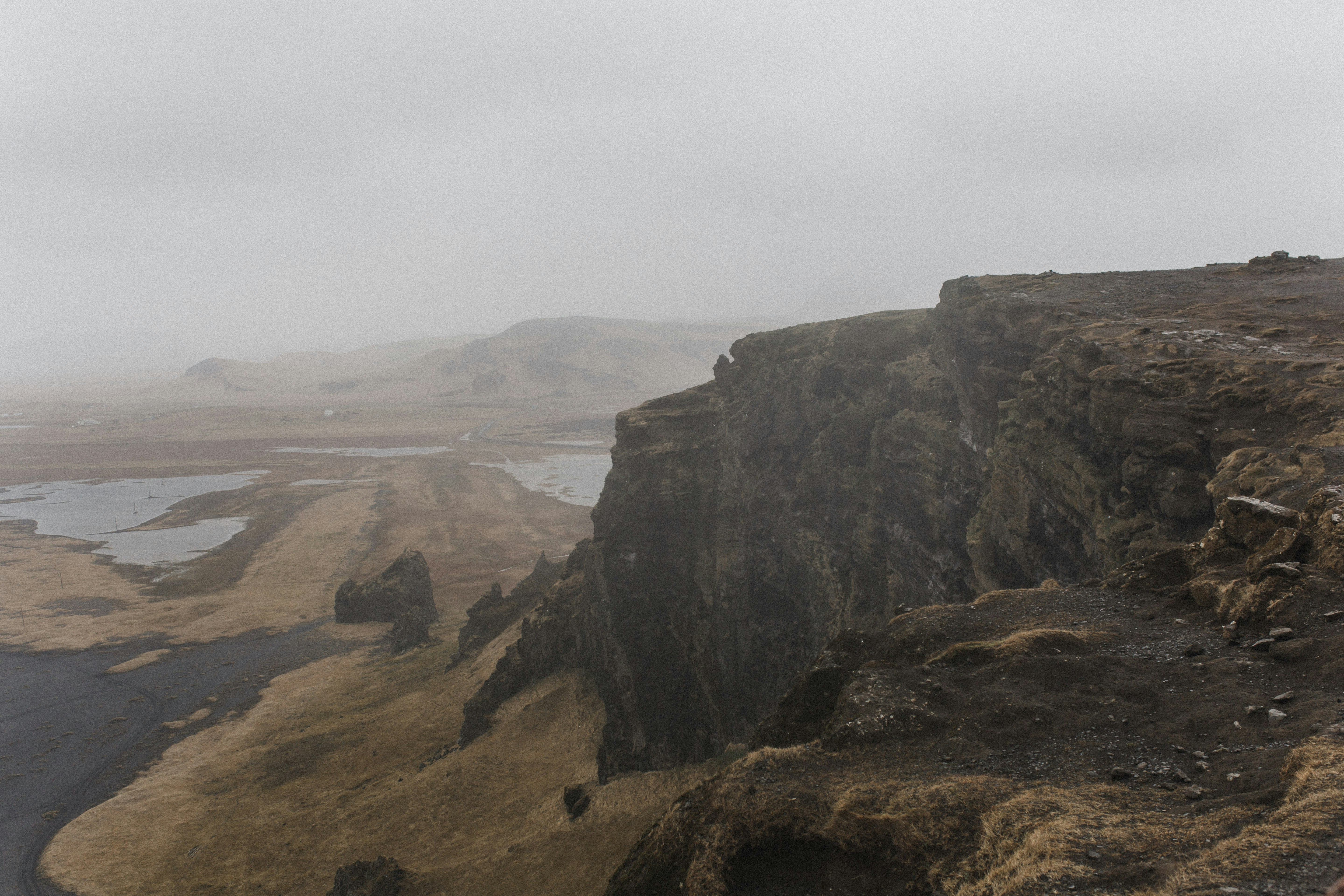 Foggy Cliff And Lowland Landscape