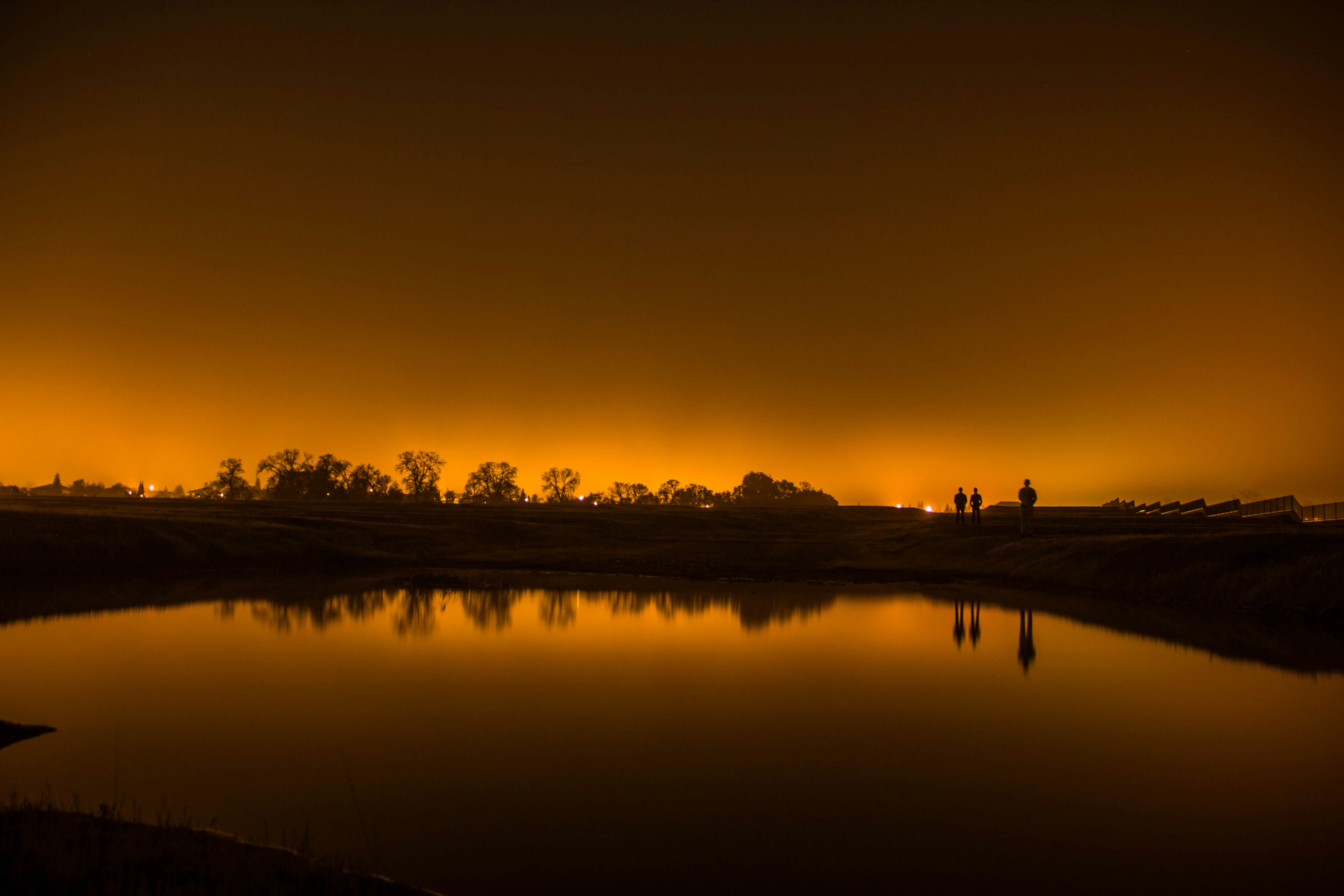 Night Waterscape Under Orange Sky Glow