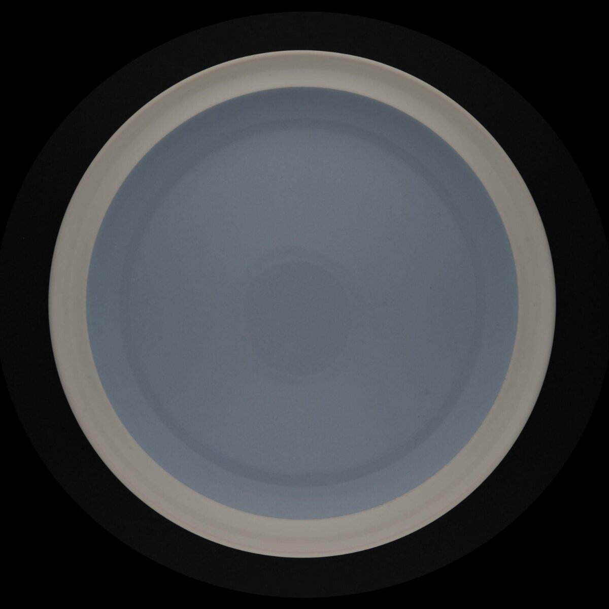 Light Blue Plate on Black Background