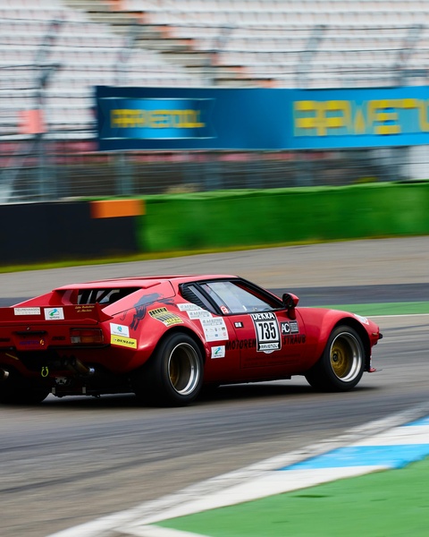 Red Race Car 135 on Racing Track