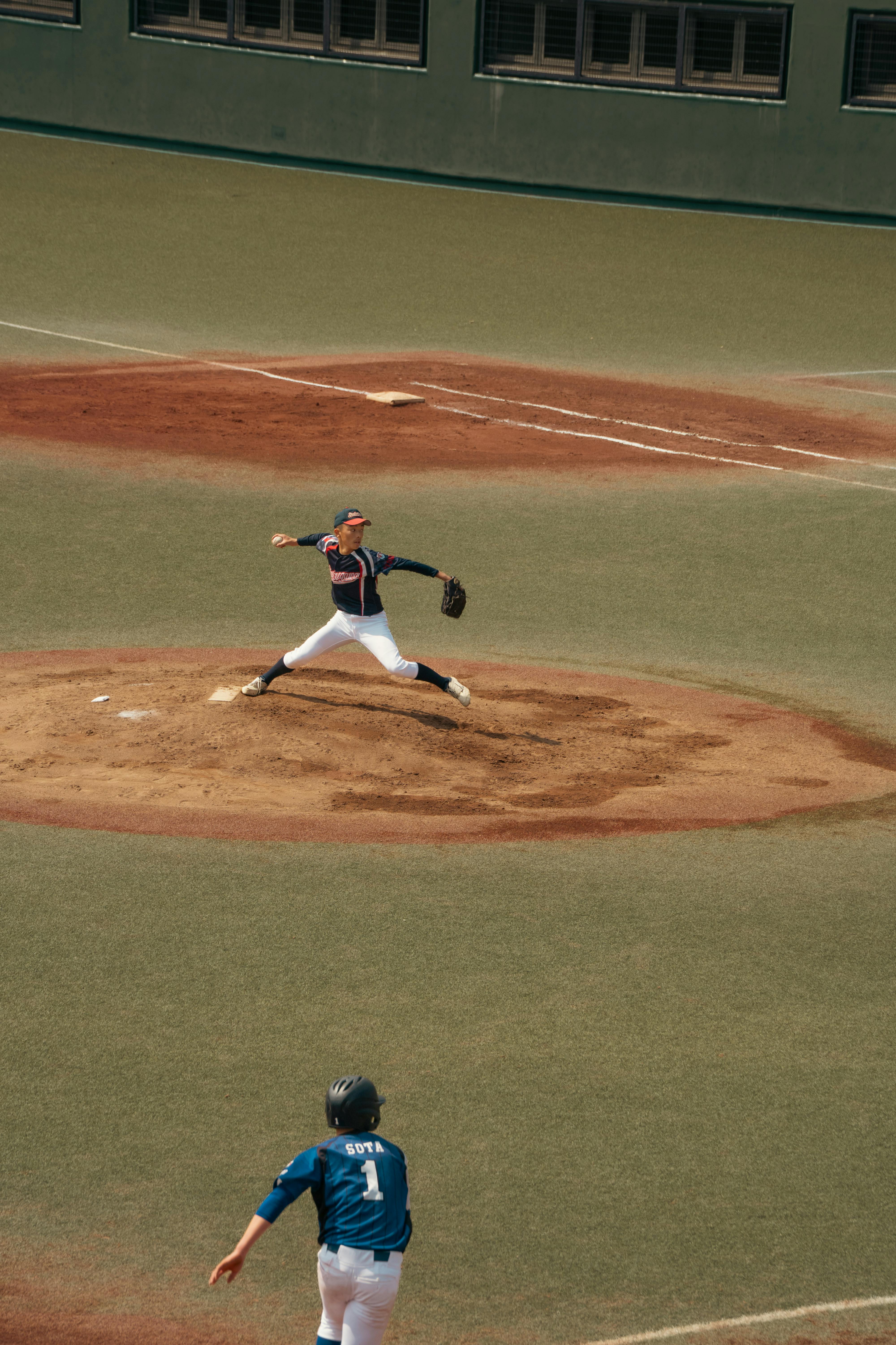 Youth Baseball Pitcher In Pitching Motion