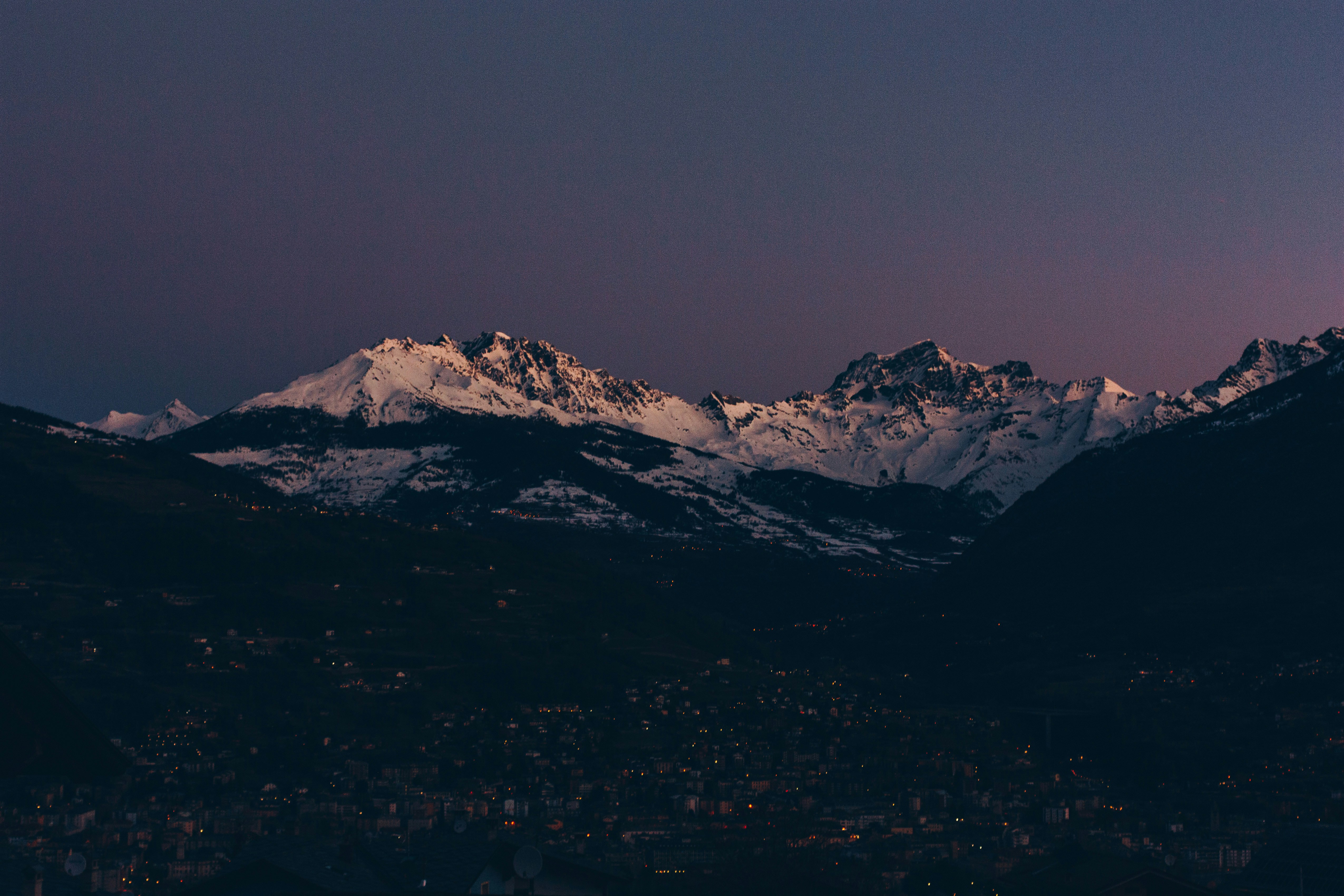 Dusk View of Snow Mountains and Valley Town