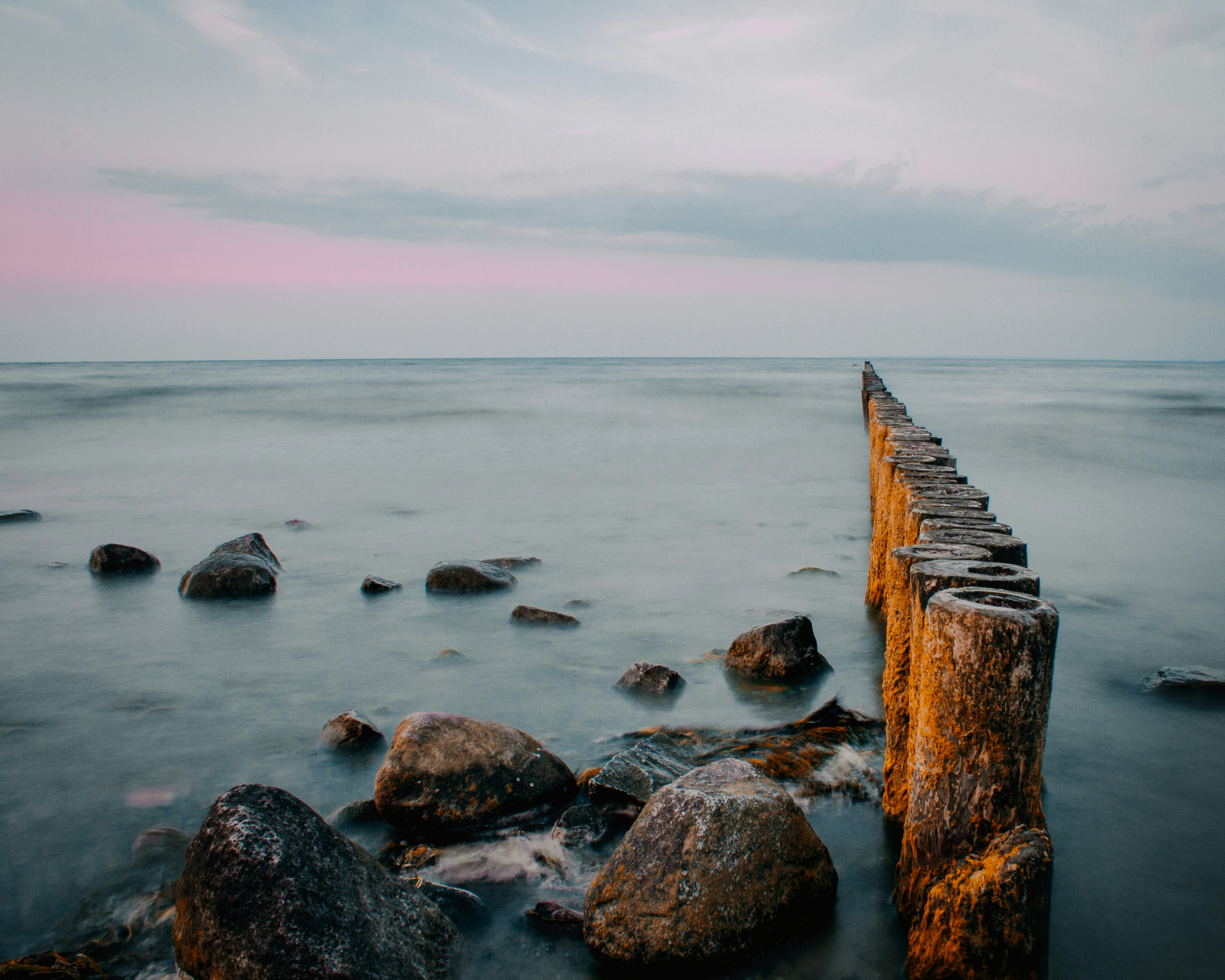 Wooden Breakwater on Calm Sea
