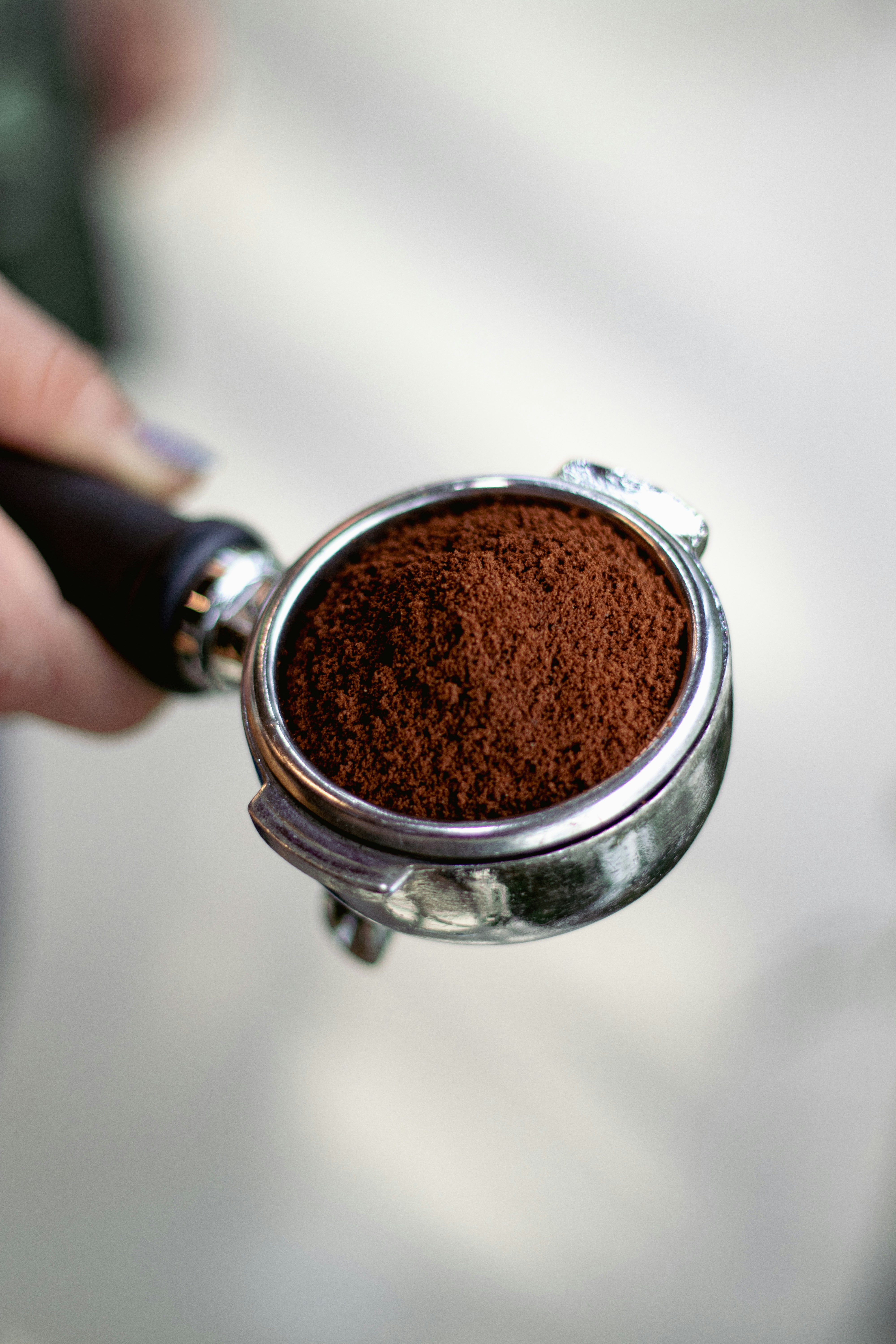 Portafilter Filled with Ground Coffee